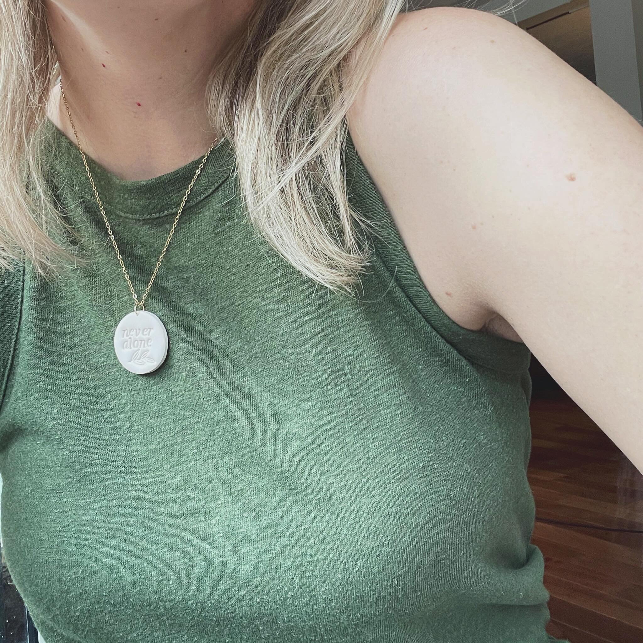 Our Never Alone polymer clay necklaces come in two colours - Linen and Slate - and are the perfect reminder that you&rsquo;re not alone on this journey! 💫