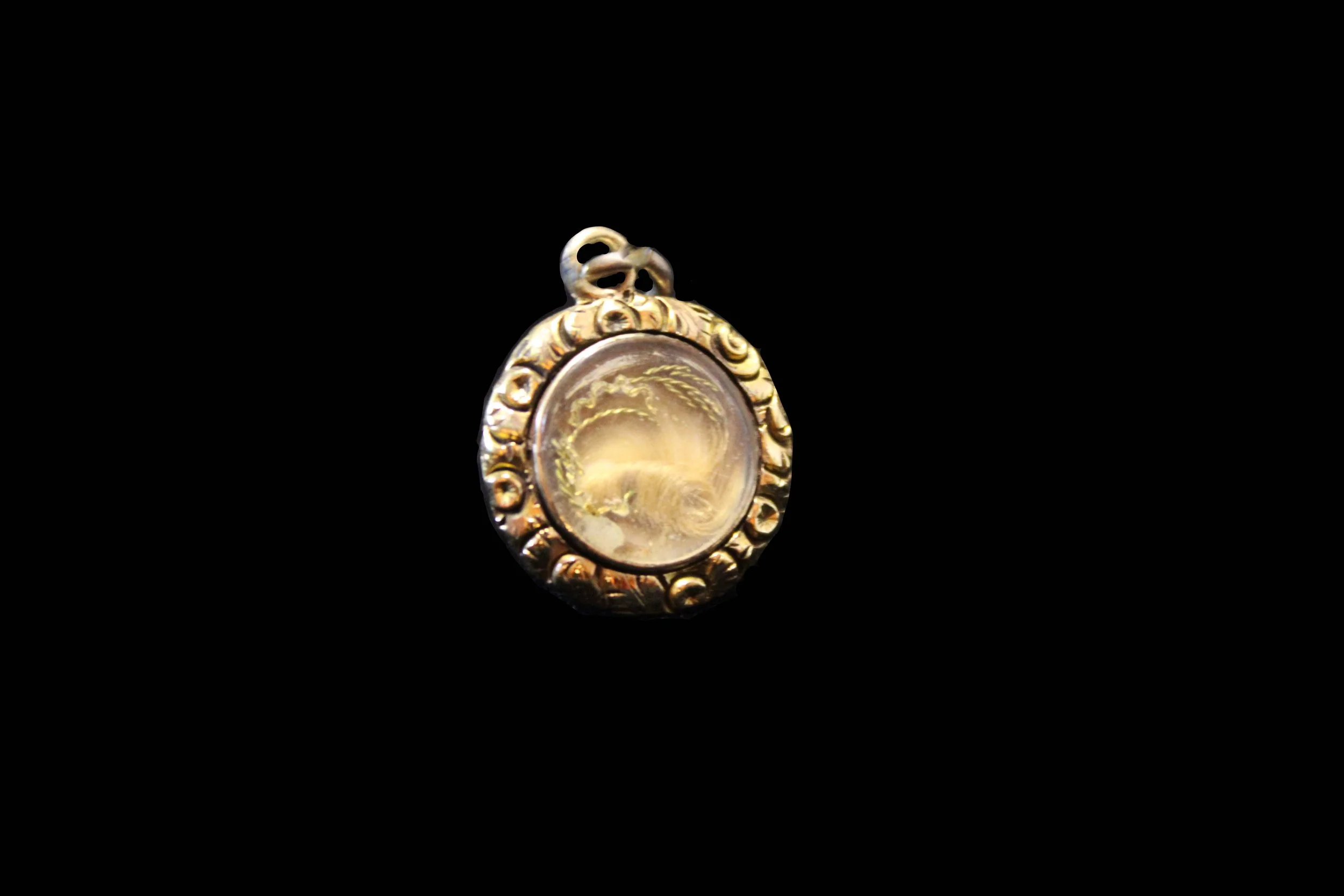 A pinchbeck memorial pendant with hairwork
