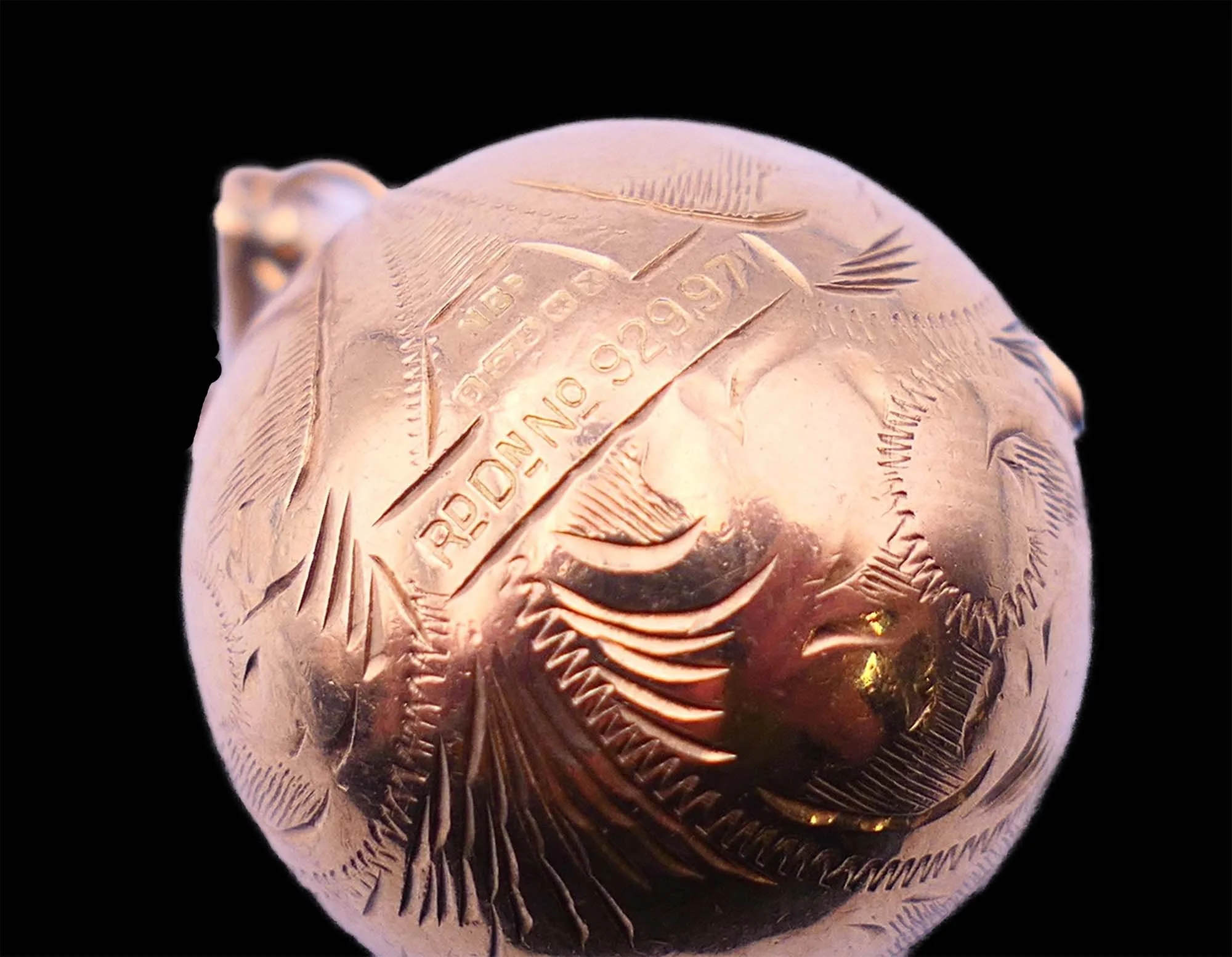 Victorian gold orb locket engraving detail with hallmark