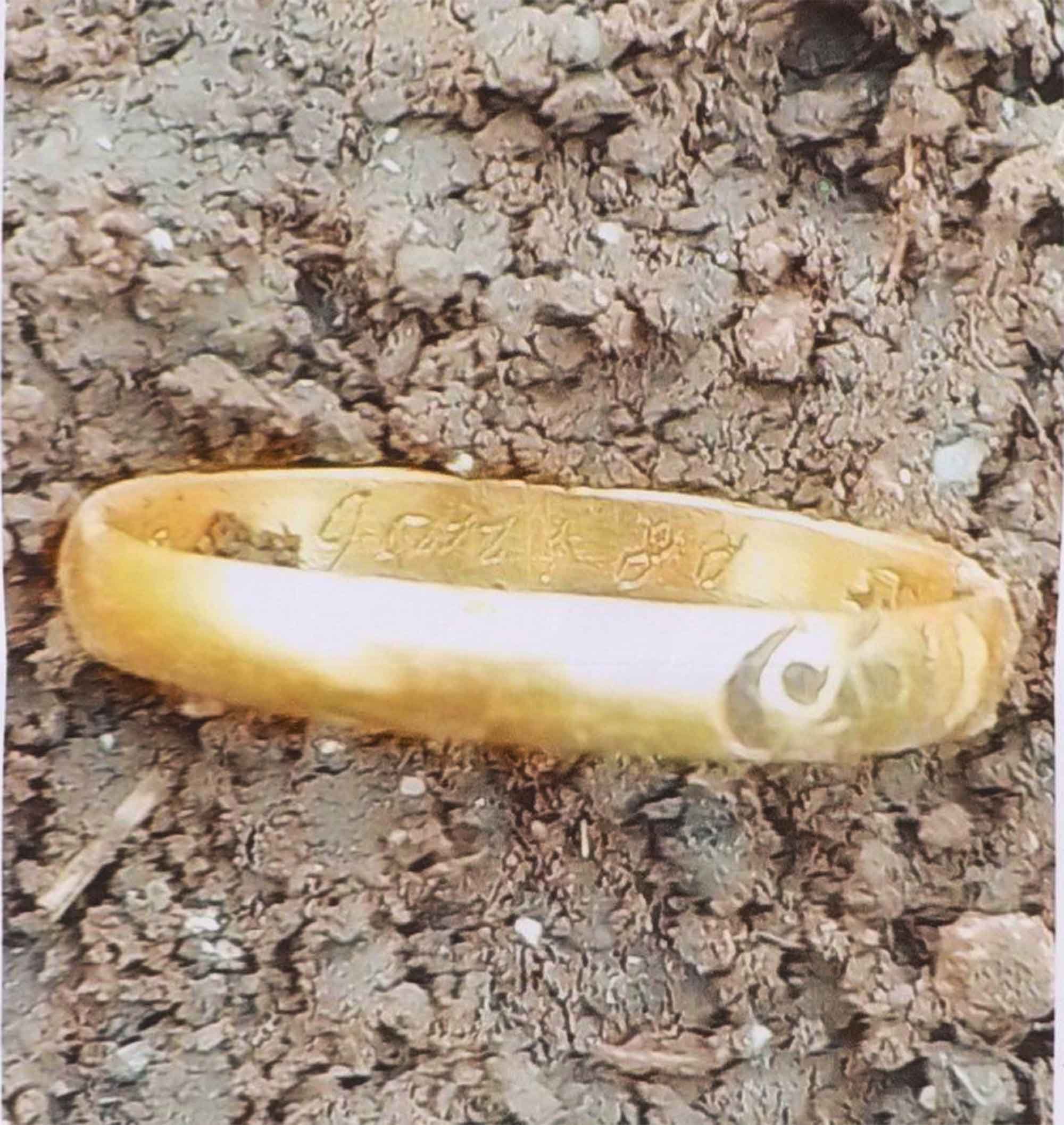 gold memento mori ring found in soil Dorset England archaeological discovery