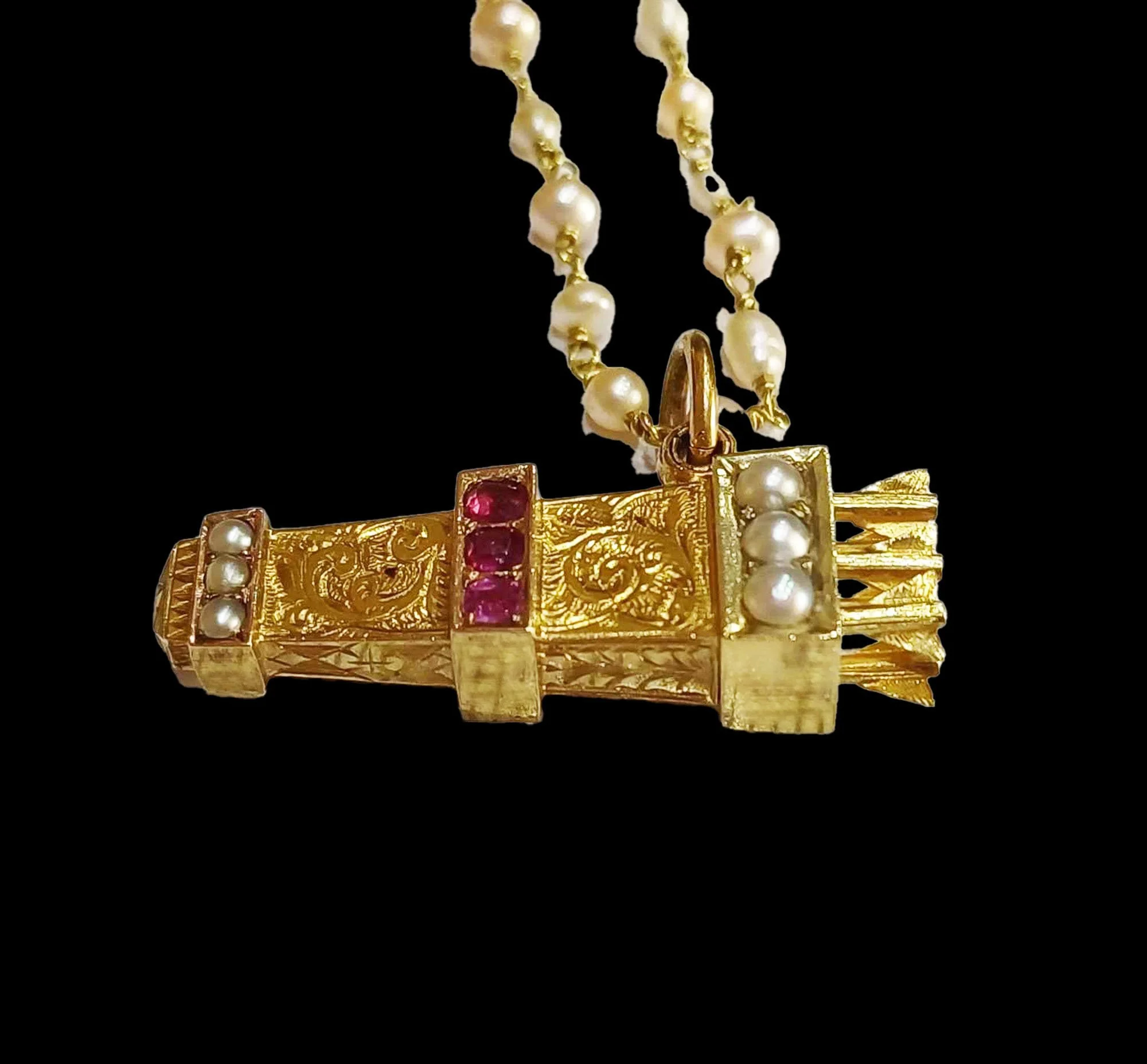 Antique gold quiver pendant set with rubies and split pearls