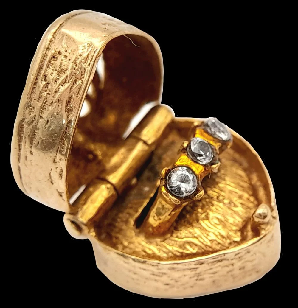Victorian heart locket opening to reveal diamond ring