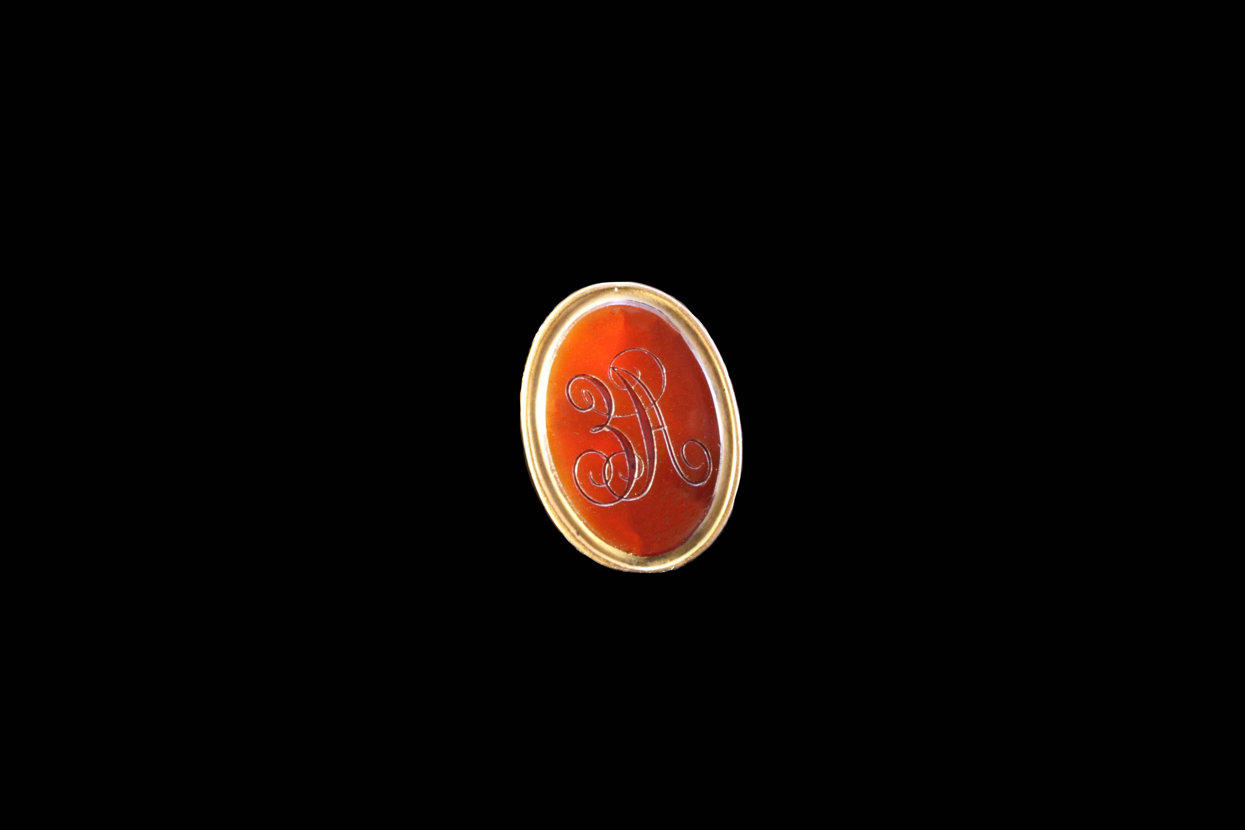 Detail view of engraved monogram on Victorian carnelian seal