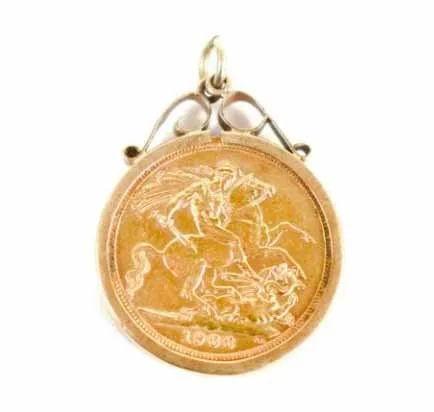 Close-up of a gold medal with an engraving of a rider on a horse fighting a serpent, dated 1968.