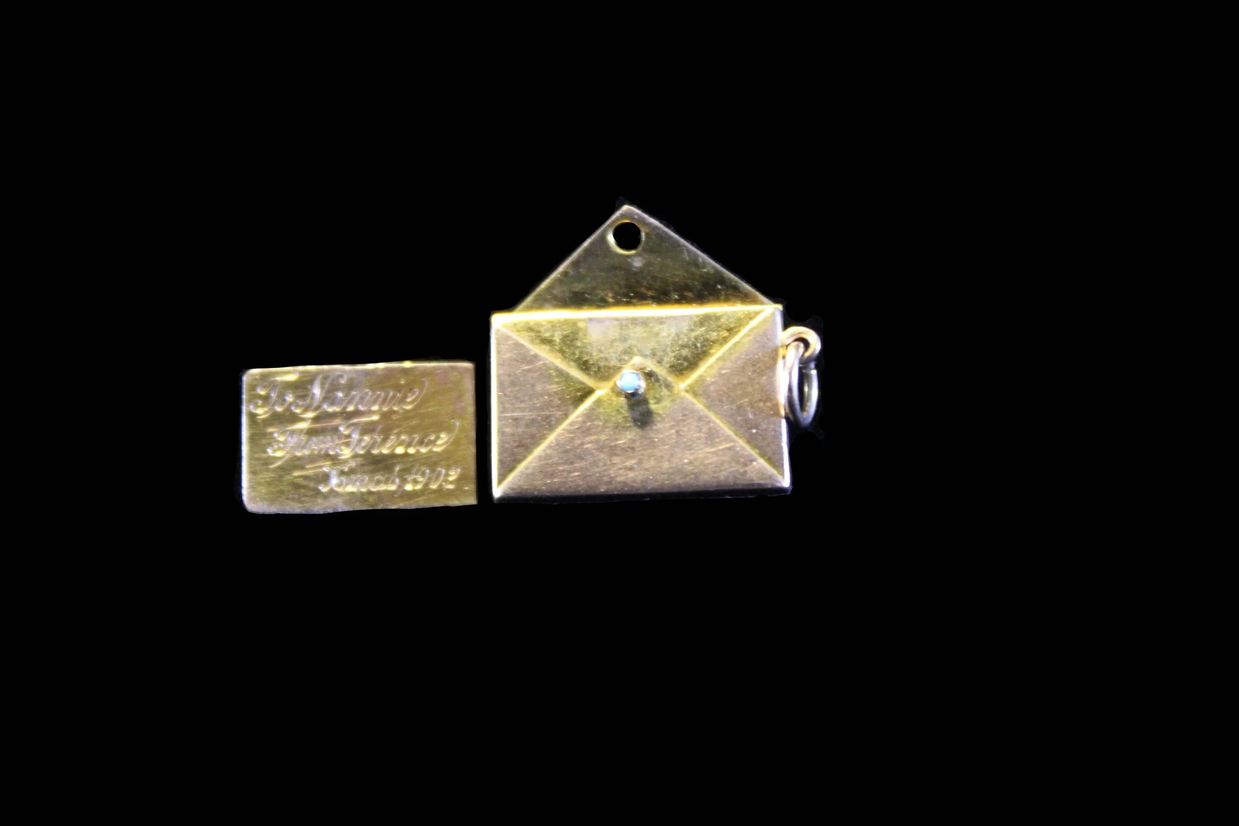 Antique Victorian gold envelope locket with hinged flap open, turquoise cabochon closure