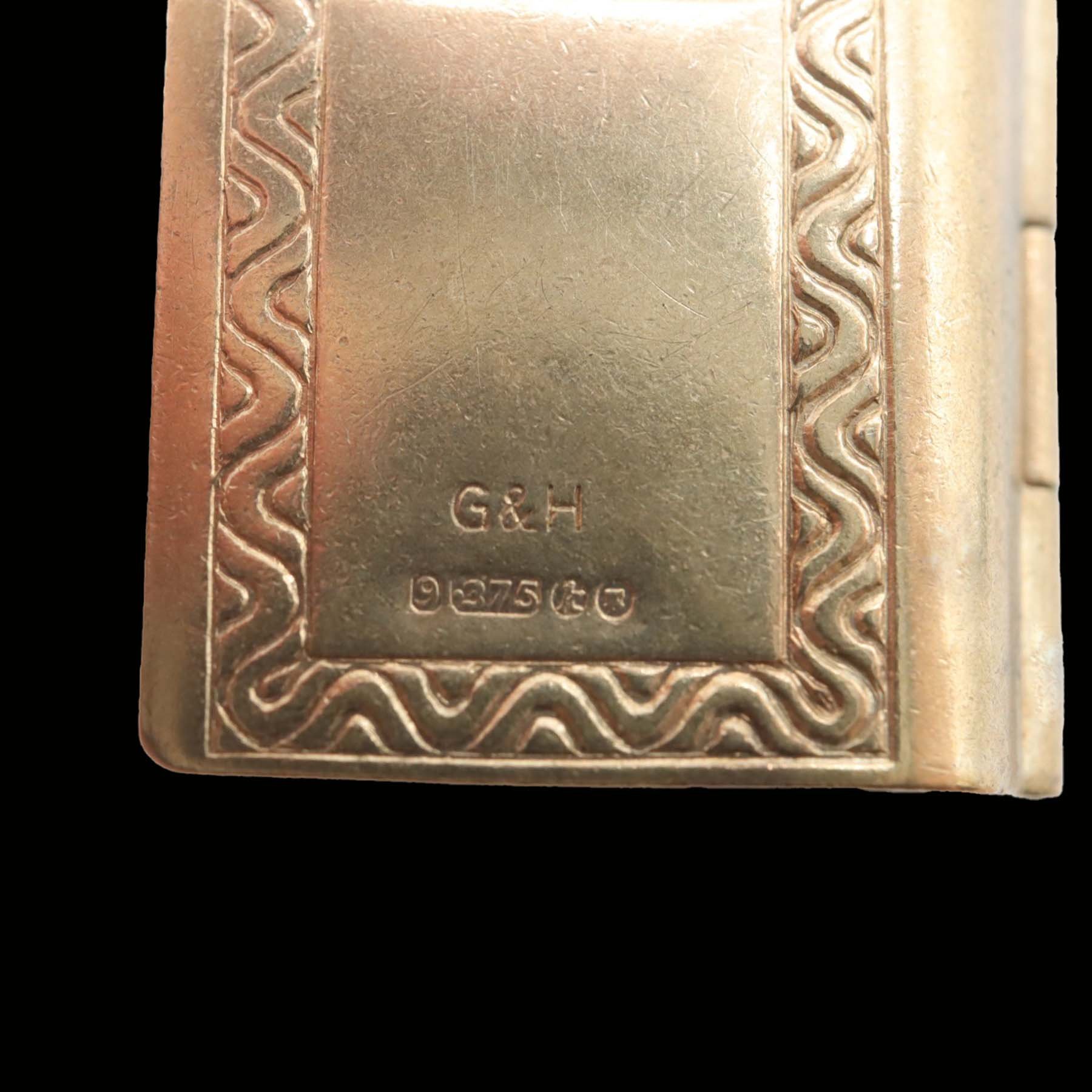 Reverse of vintage 9ct gold London book charm with British hallmarks and maker's mark G&H
