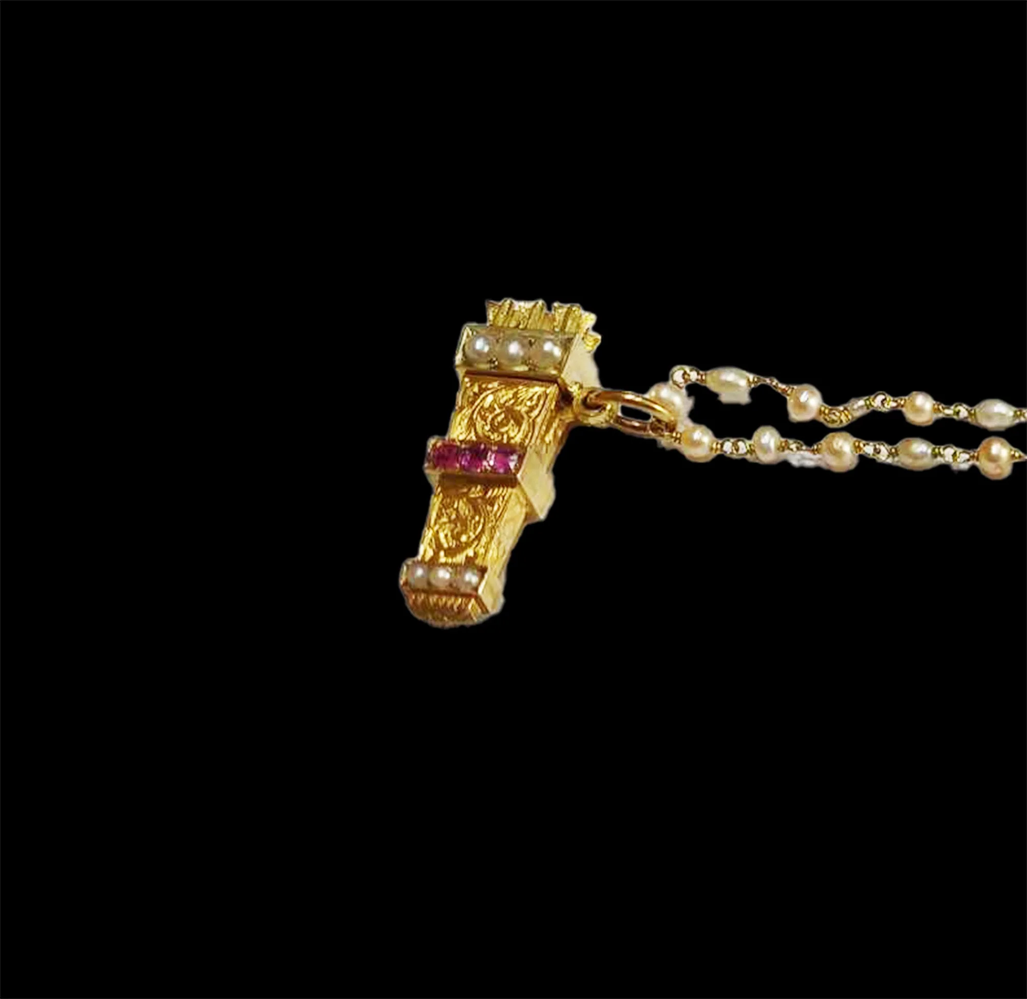 Detailed engraving on antique gold arrow quiver pendant