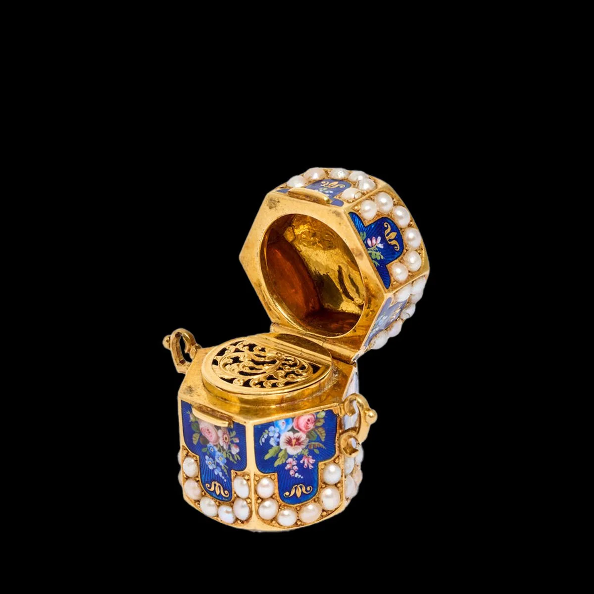 Open antique Swiss 18K gold and blue enamel vinaigrette revealing an ornate pierced gold fragrance grille beneath its hinged lid.
