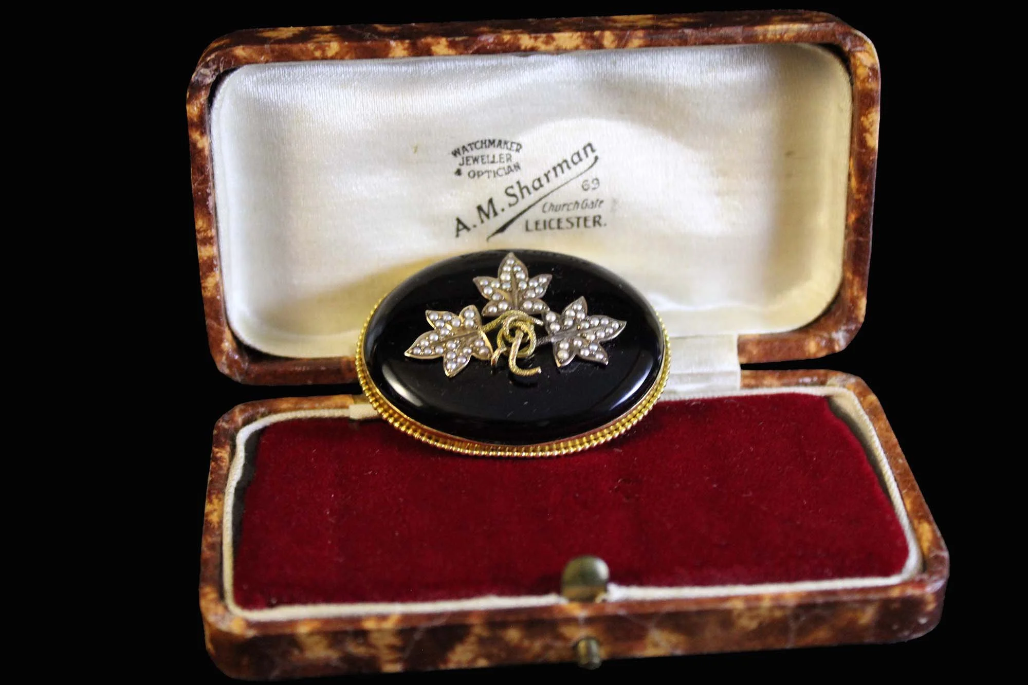 locket in antique jewelry presentation case