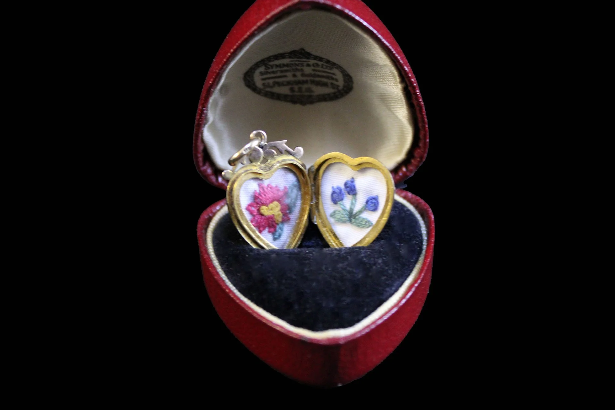 hand embroidery inside locket in presentation case.jpg