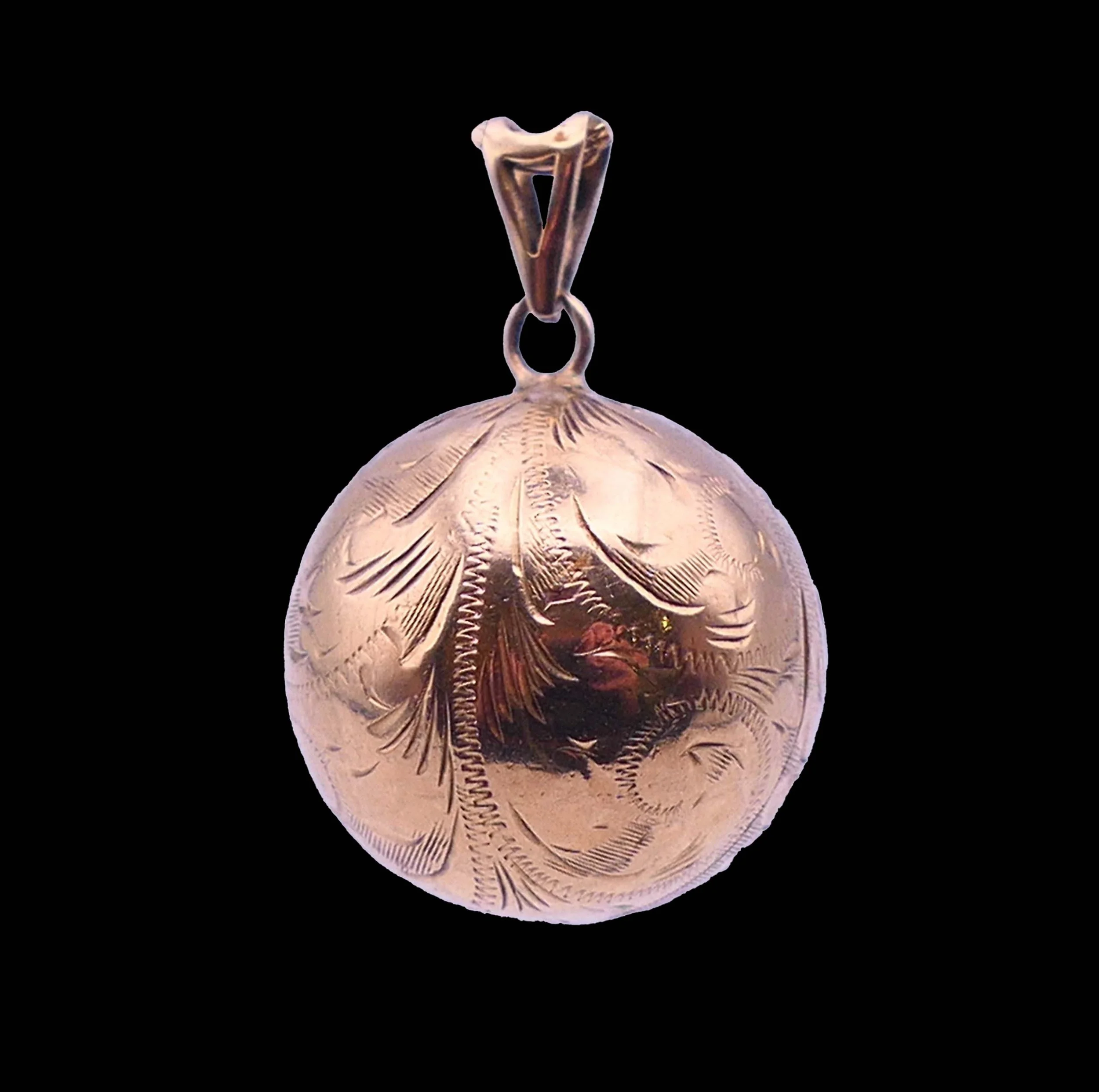 Front view of Victorian 9K gold orb locket pendant with hand engraved pattern