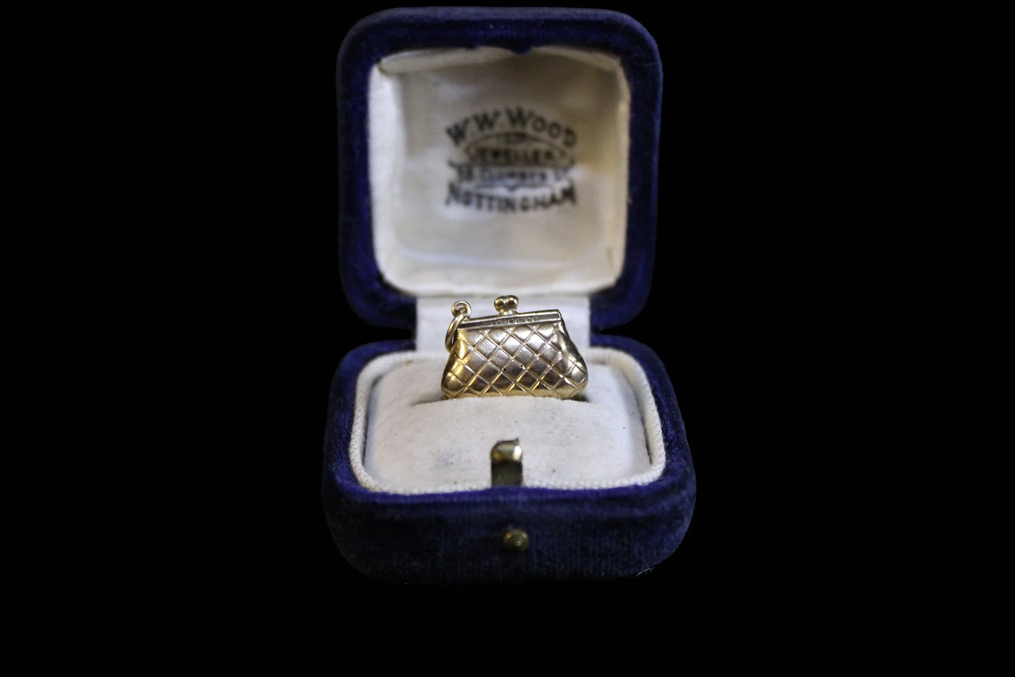 close-up charm in antique jewelry case.jpg