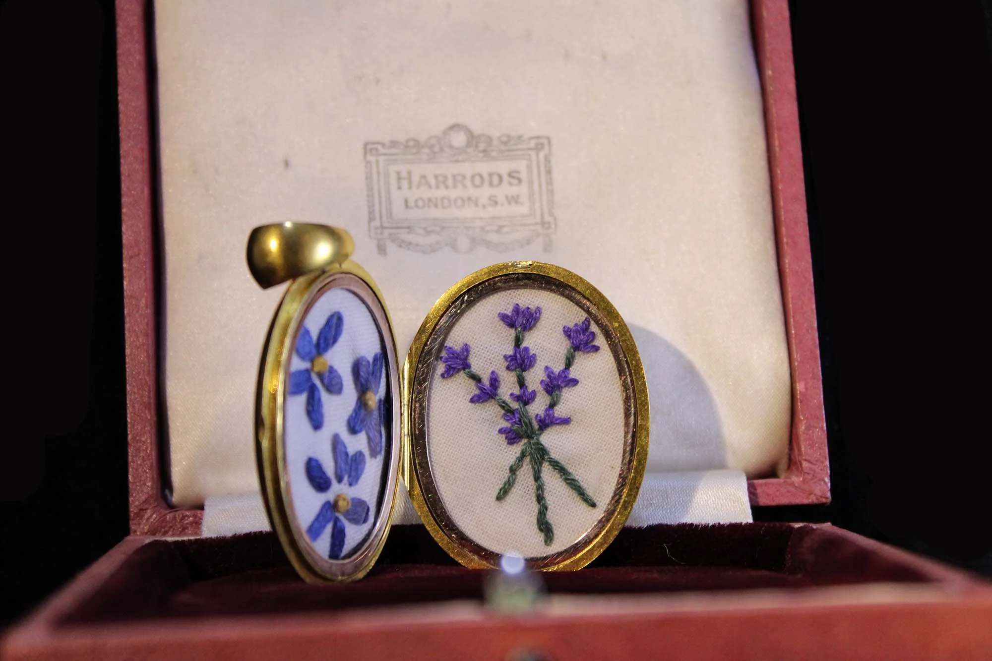 close-up hand embroidery flowers in locket