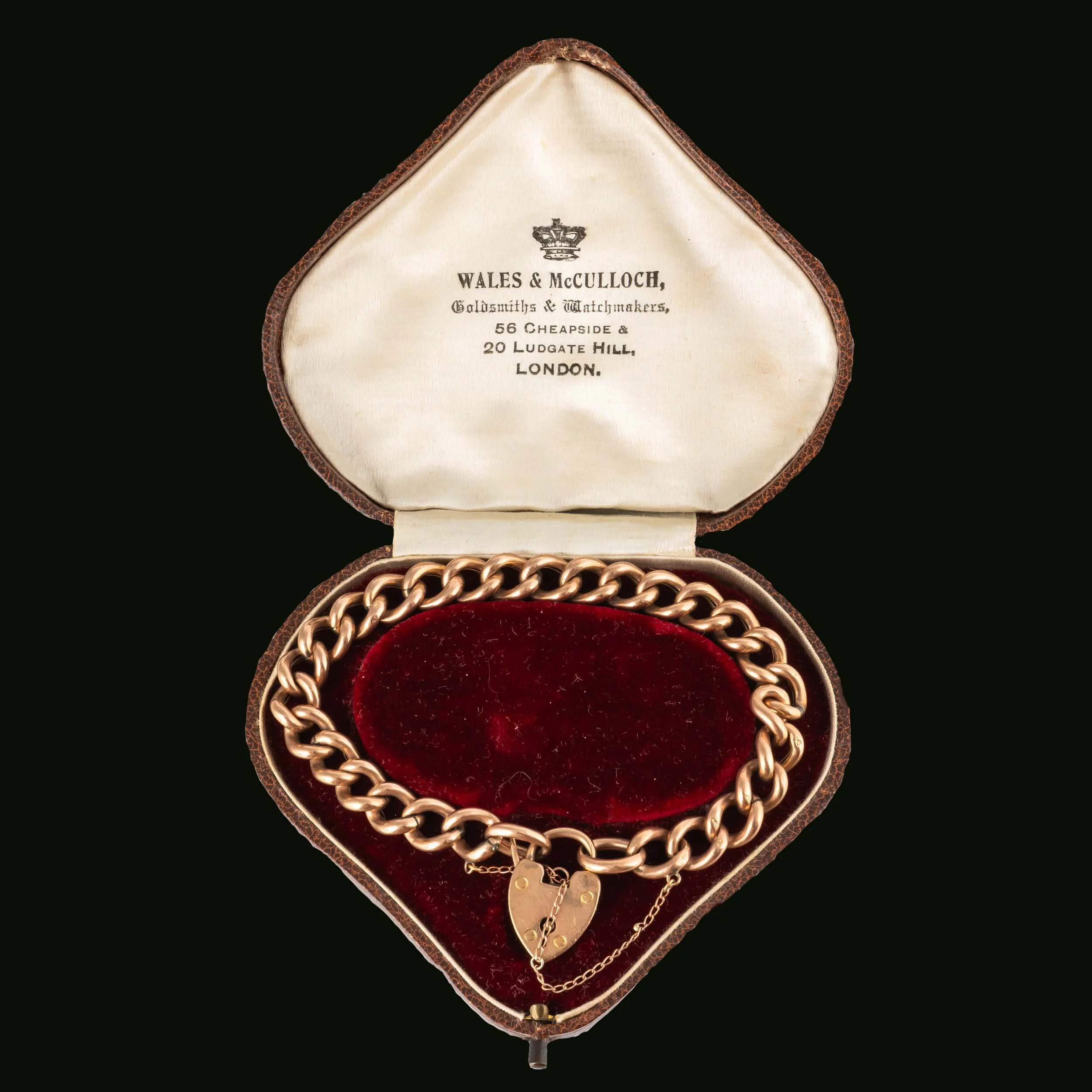 Antique Victorian gold curb link bracelet displayed in original Wales & McCulloch fitted case