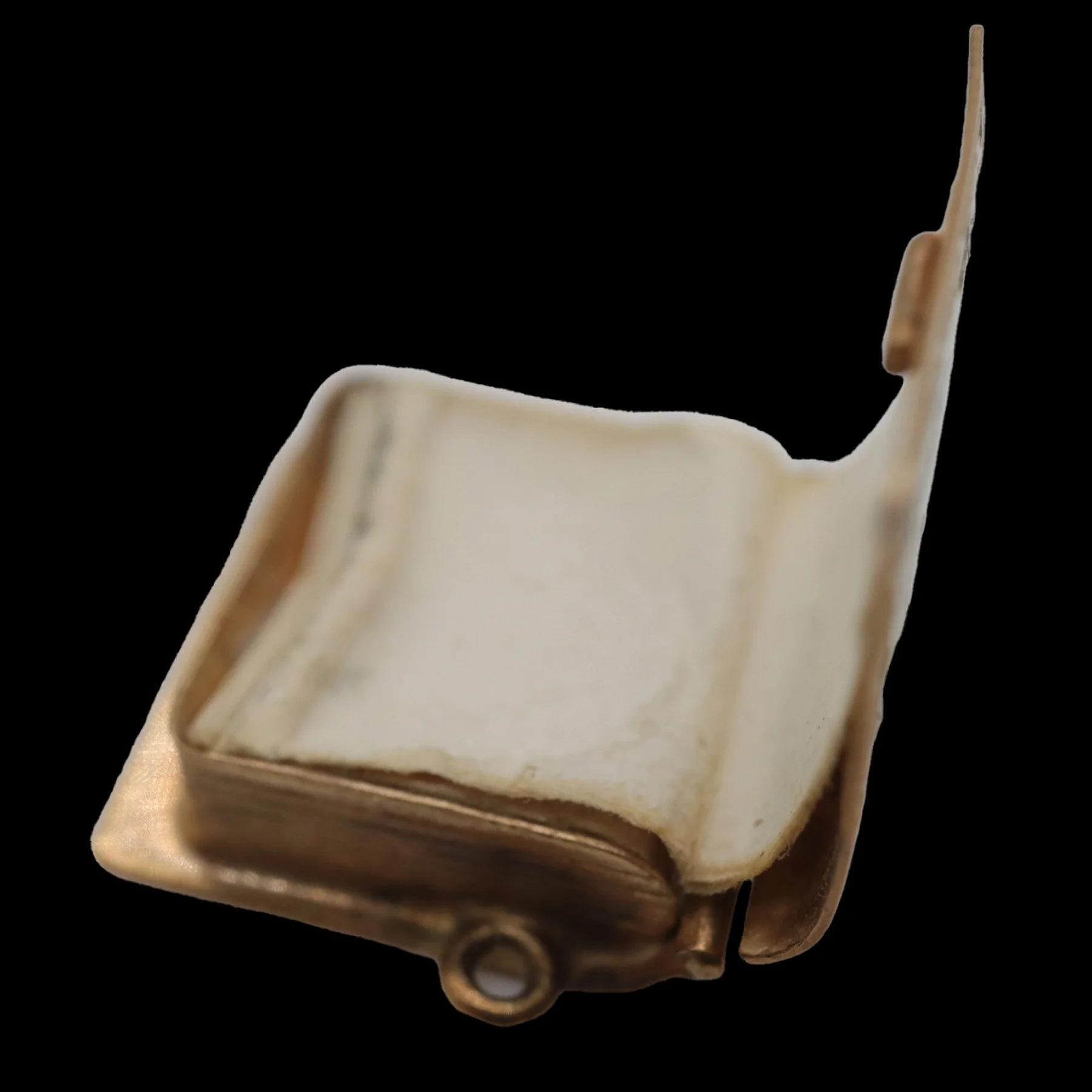 Interior of vintage gold London book charm showing original paper pages.