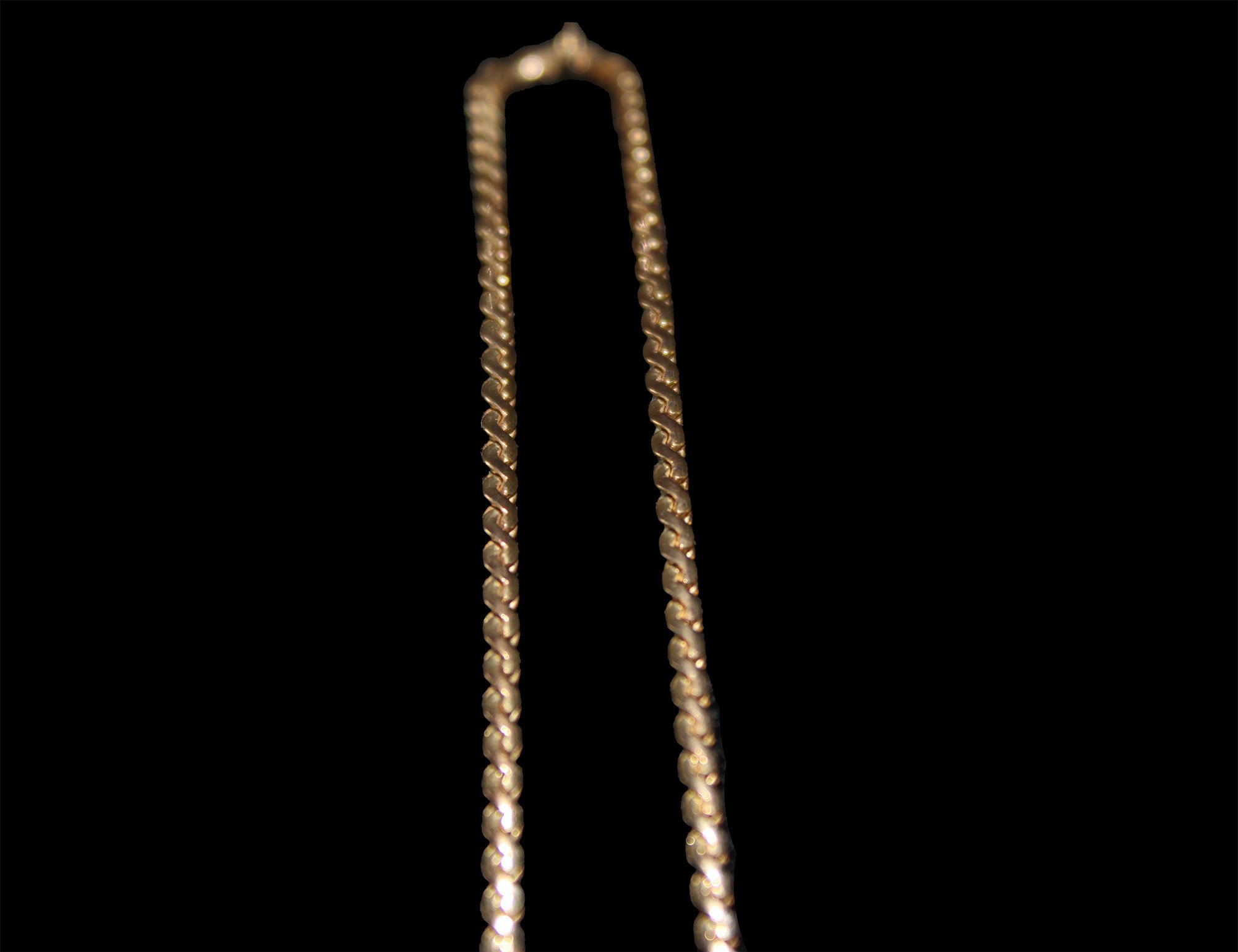 close up substantial nine carat gold curb link chain
