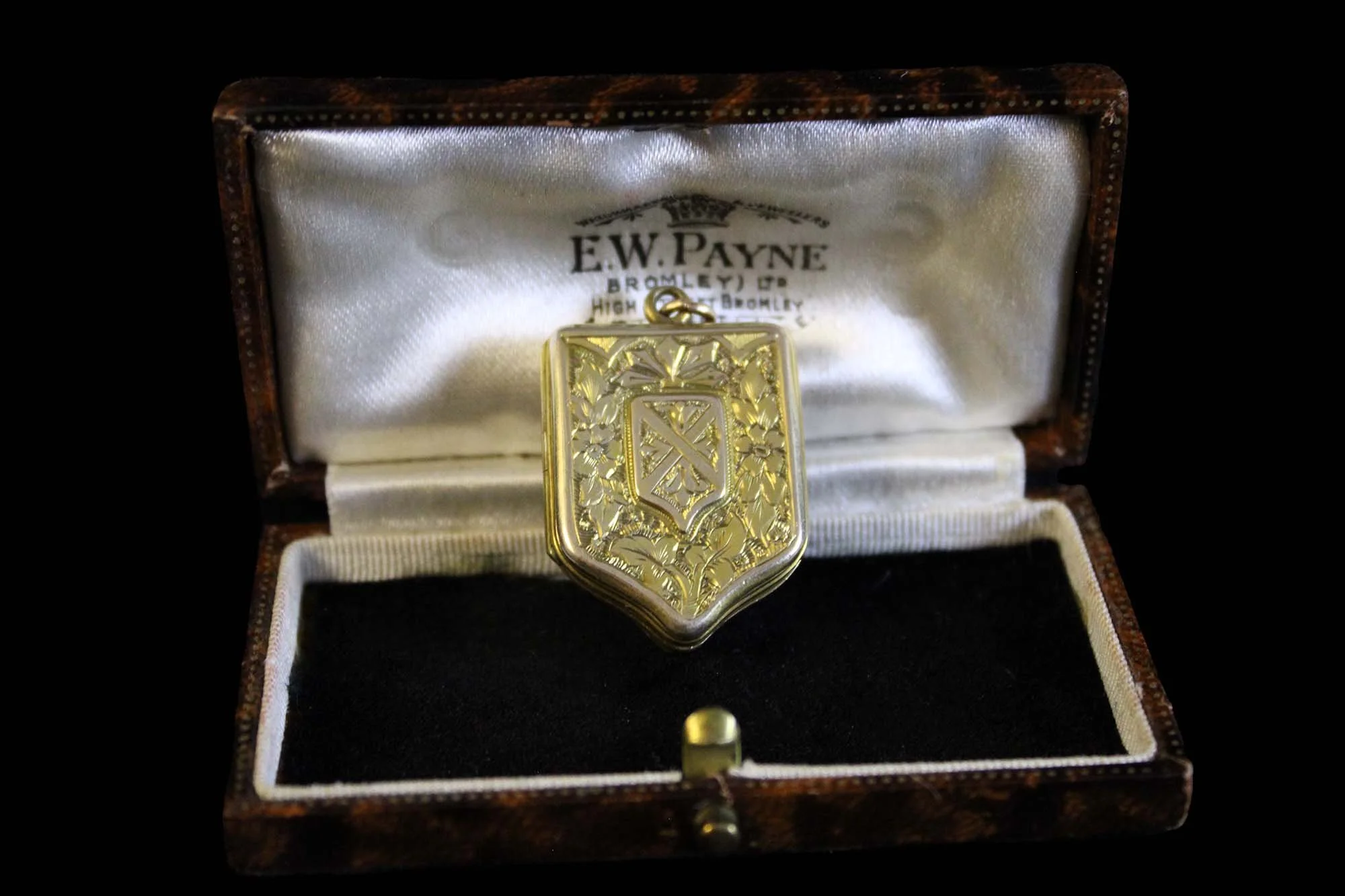 heraldic shield locket within antique jewelry presentation case