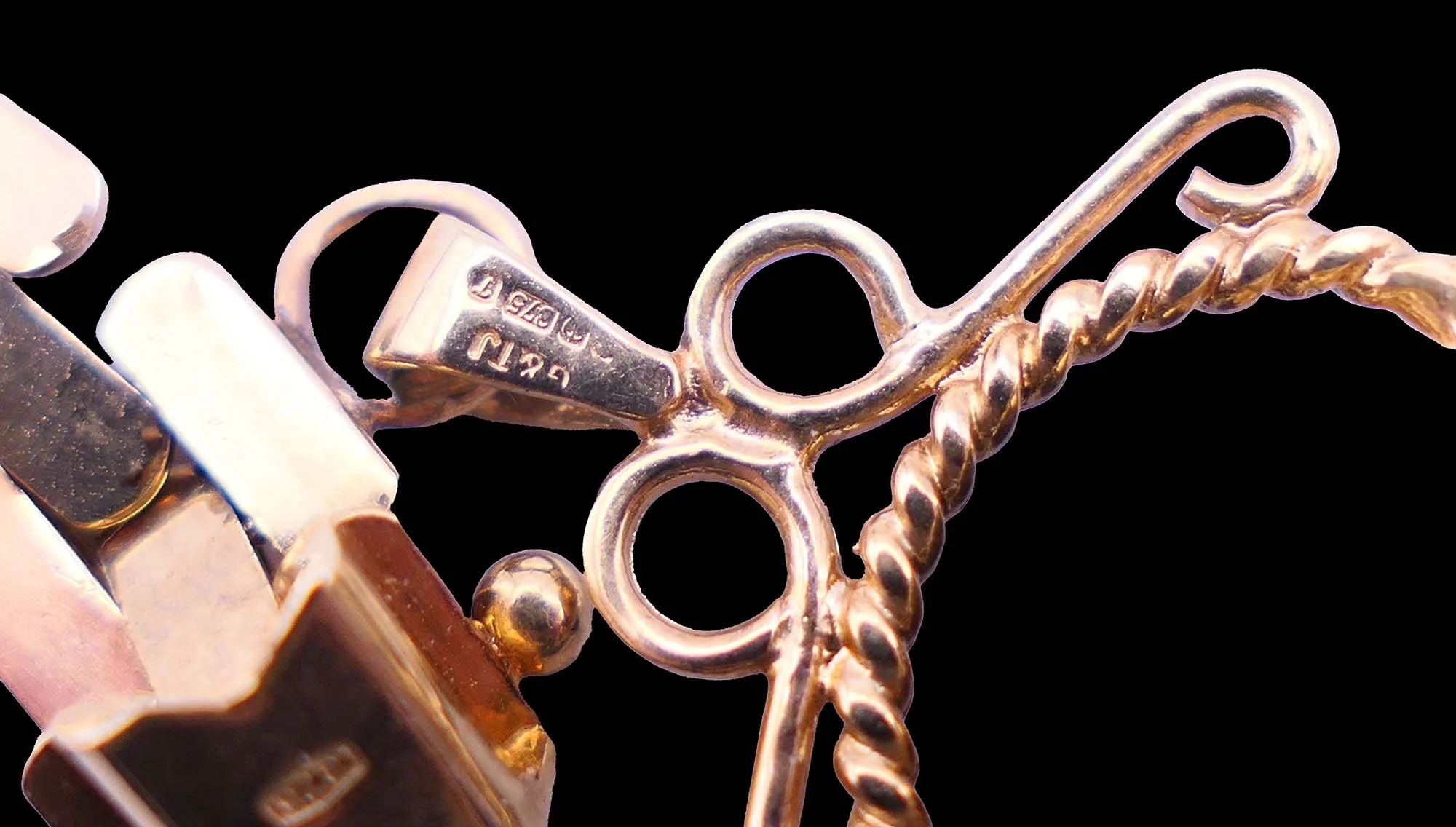 Rotating fob mechanism antique gold bracelet detail