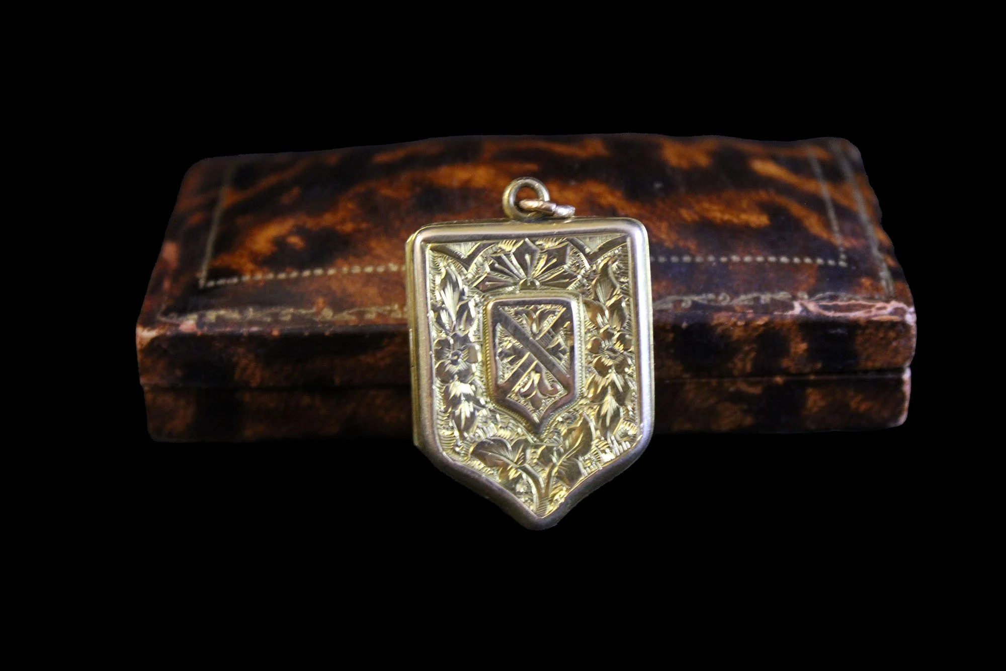 heraldic shield locket with antique jewelry presentation case
