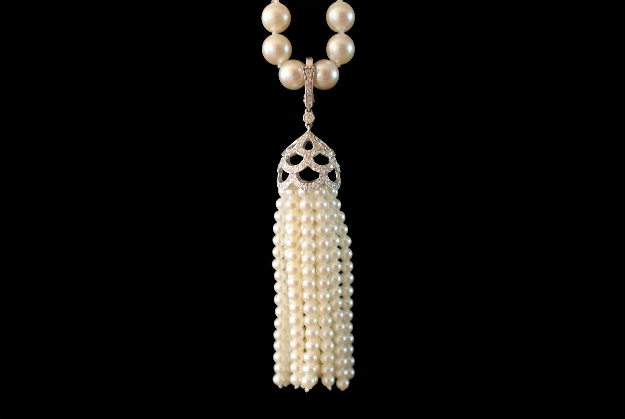 white gold, diamond and pearl tassel attached to pearl necklace