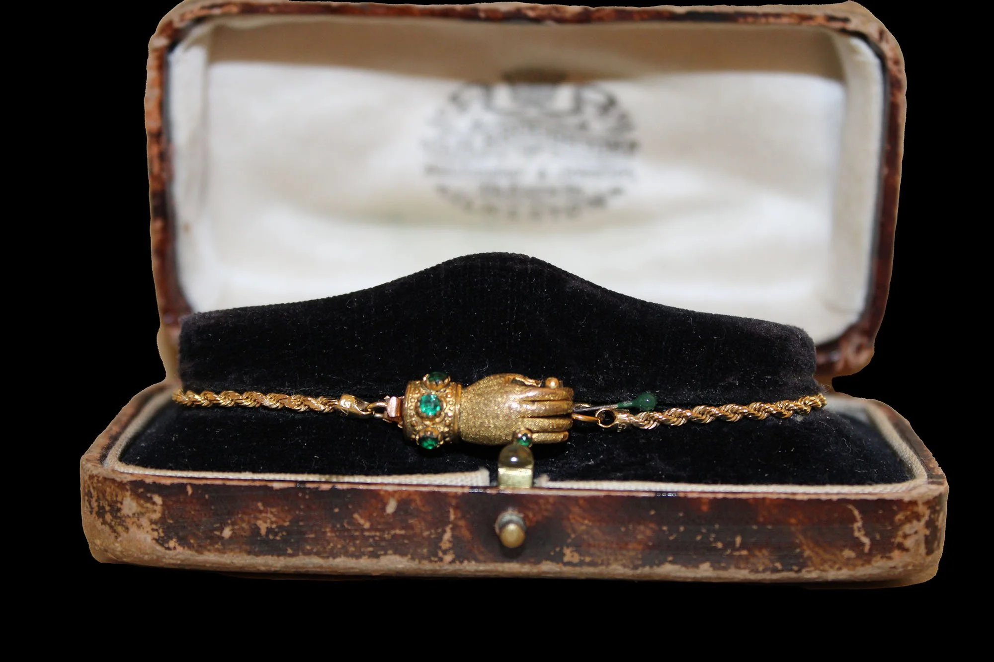 Victorian 9K gold hand clasp bracelet displayed inside an original antique presentation case.