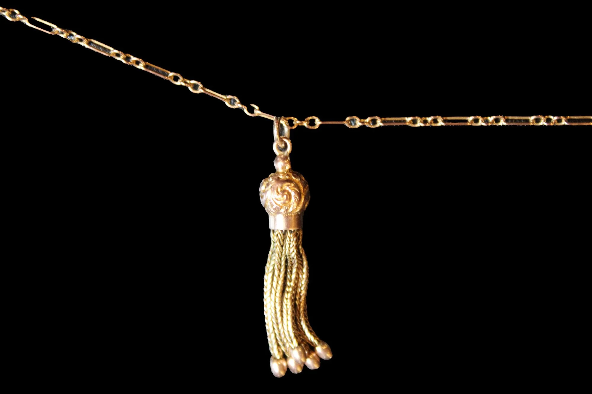 Victorian 9K rose gold tassel pendant shown with an antique chain
