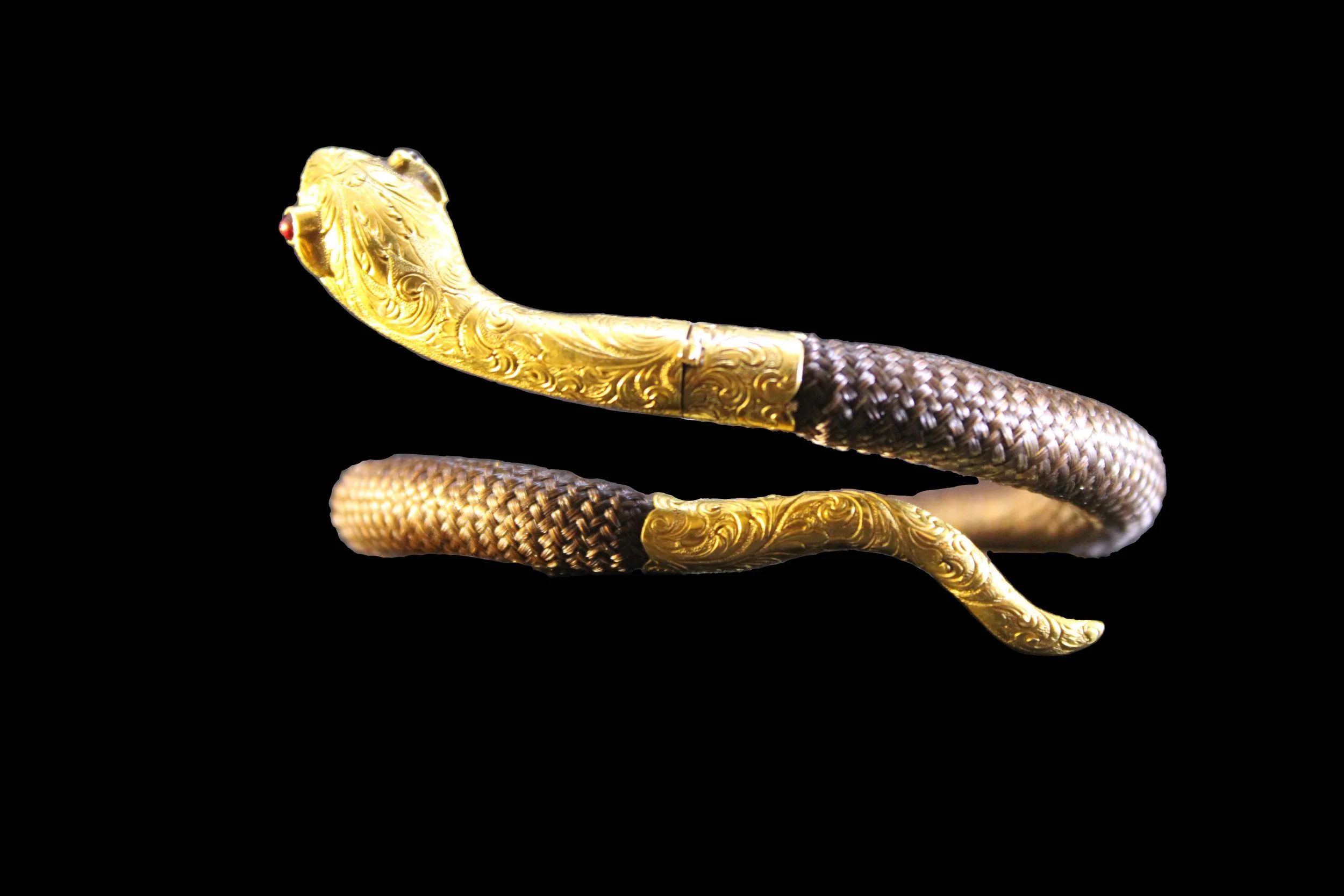 Victorian hairwork serpent bracelet showing engraved gold head and tail terminals