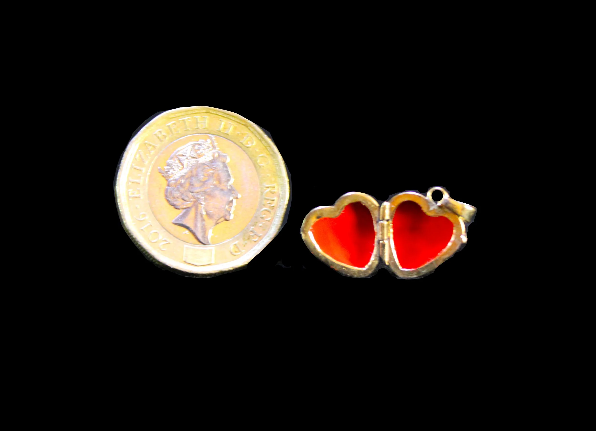 Victorian gold heart locket scale shown with coin