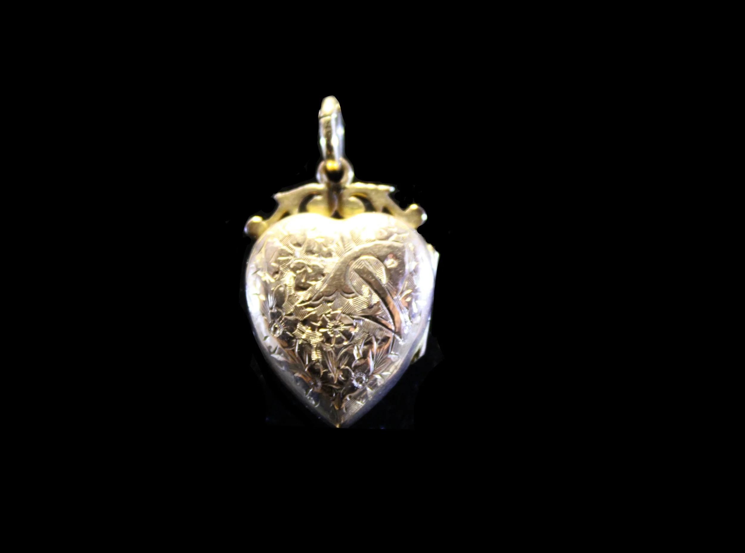 Victorian engraved heart locket designed to hold a miniature or lock of hair