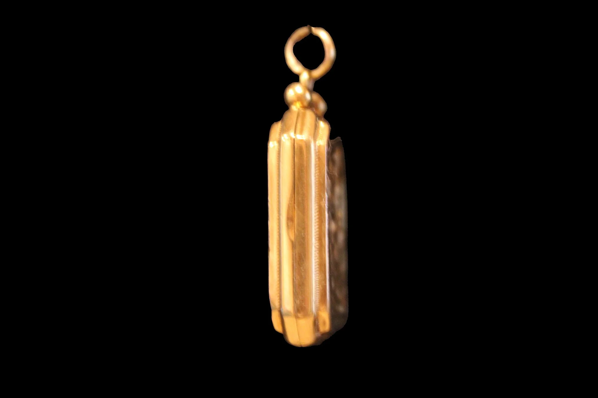 Side view opening Late Victorian Engraved Gold Locket