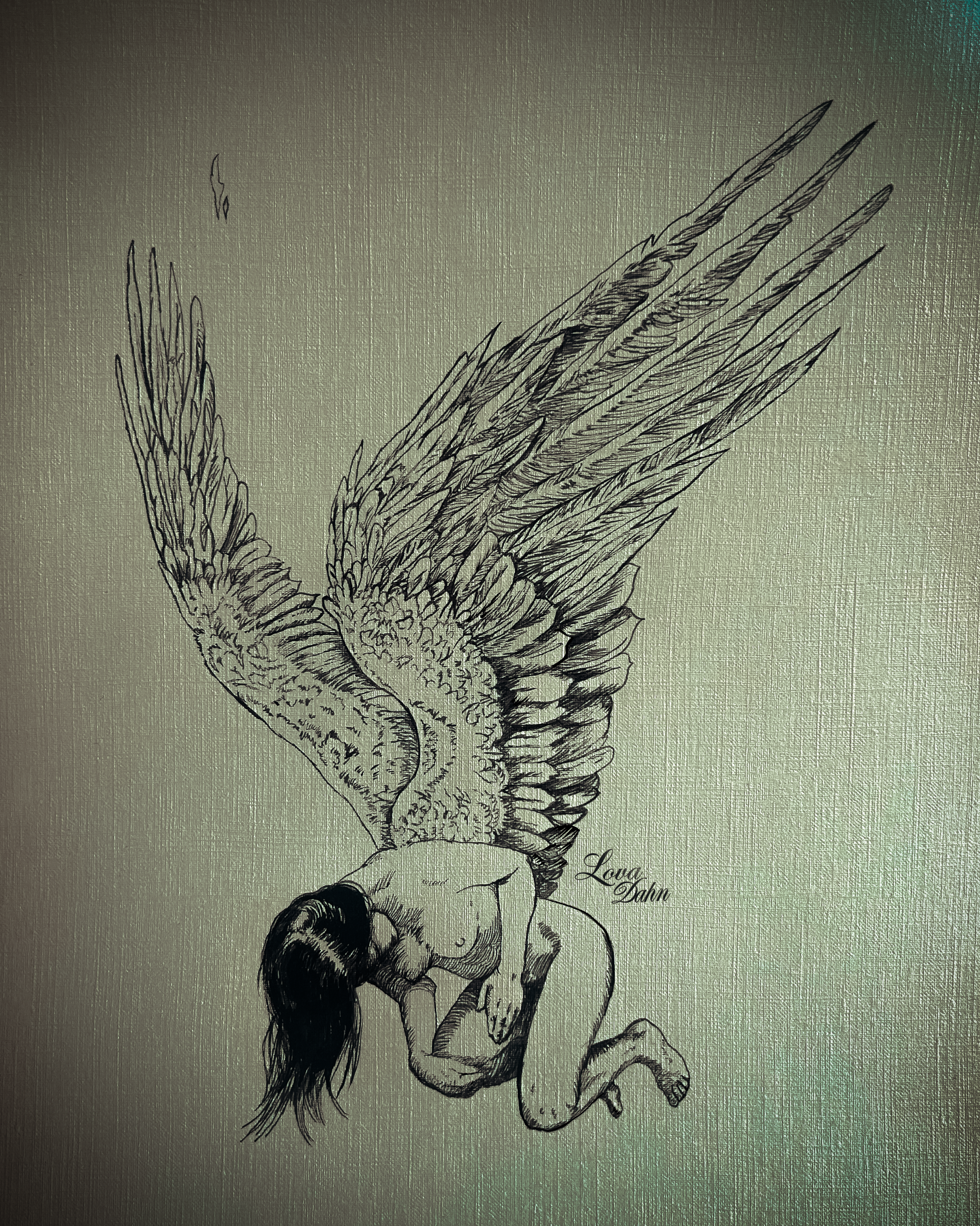 A black and white line drawing of a woman with long hair, kneeling and has large detailed white wings growing out of her back. The text "Lova Dahn" can be seen near the bottom right of the image.