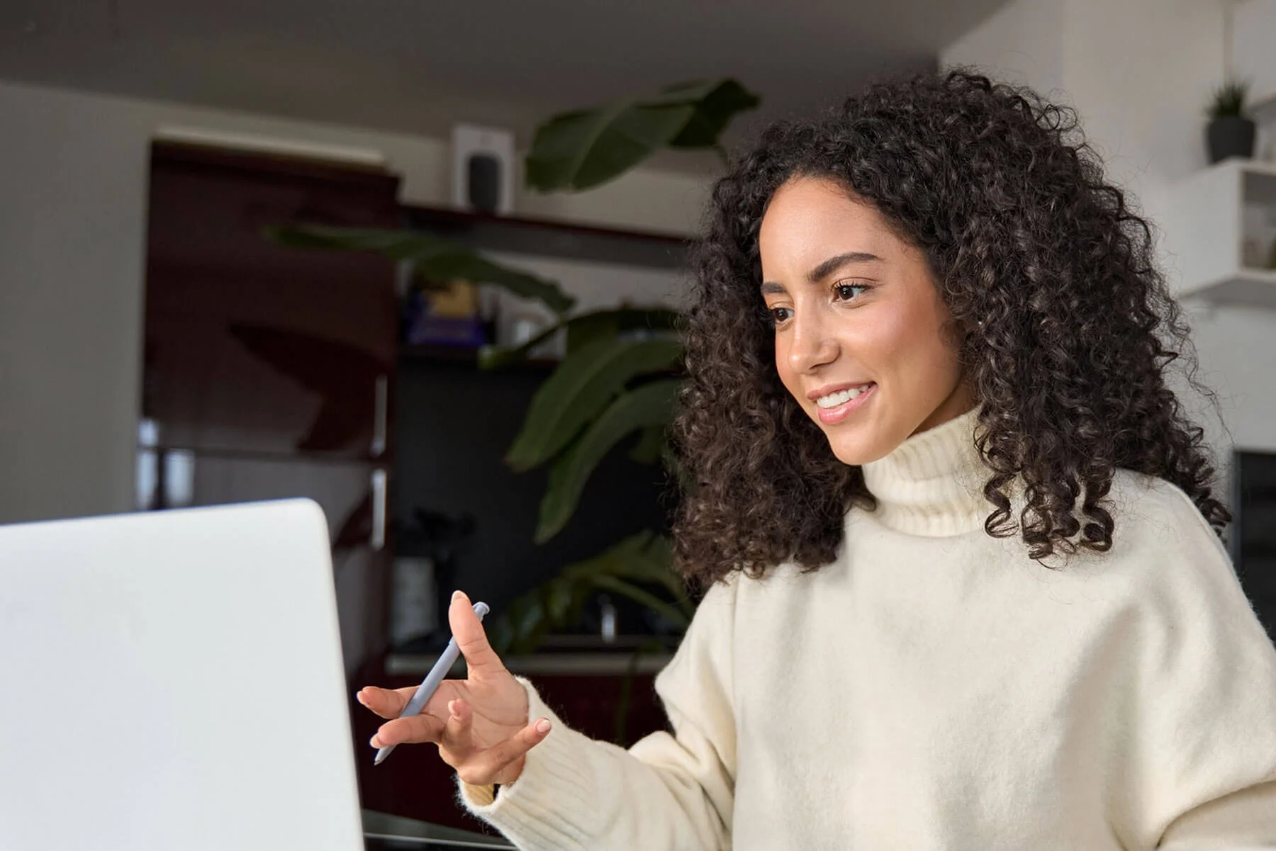 woman smiling and talking on video call