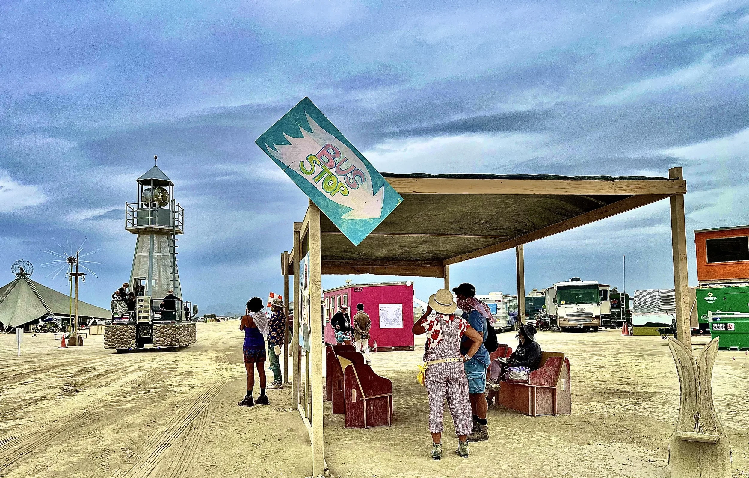  Just beyond the “Welcome to BRC” sign is the Bus Stop. This is the best place to wait for the BxA Airport Shuttle Bus to take you into the city or if you are lucky, this is where a random art car will magically show up to take you! 