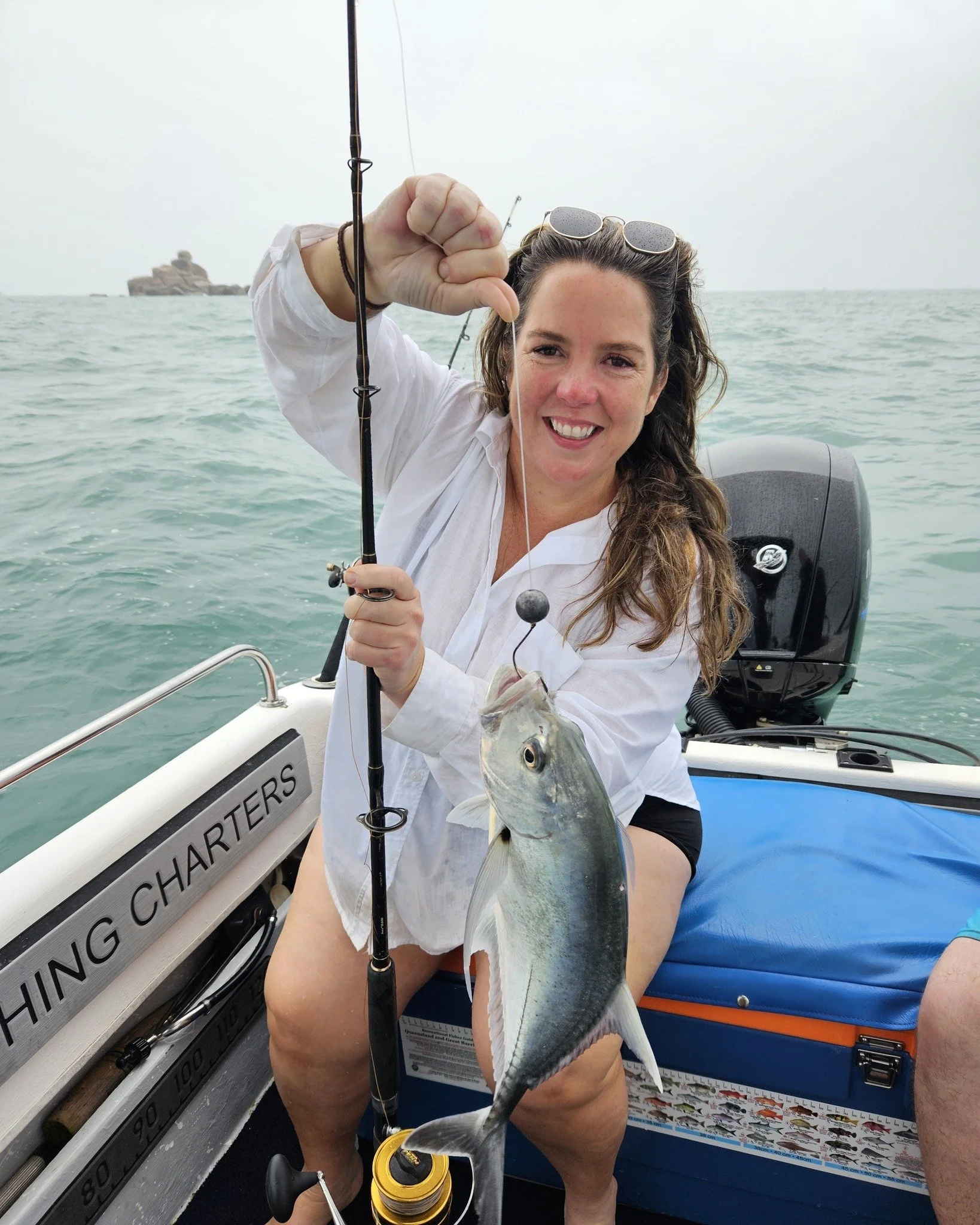 Cherie with her first GT which was released successfully. #magneticislandfishingcharters #lowrance #uglystick #mercuryoutboards #mercurymarine #halco #fishingcharters #GreatBarrierReef #reeffishing #reeffish #reef #gianttrevally #pennfishing #penn #t