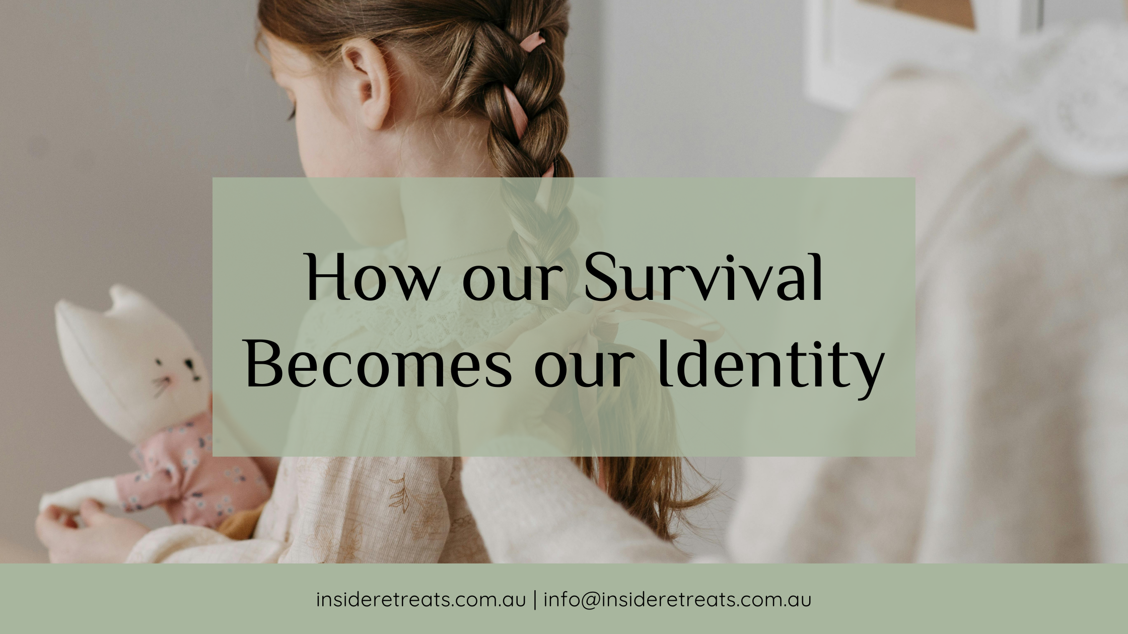 A young girl holding a toy cat has her braided hair tied with a pink ribbon by an adult.