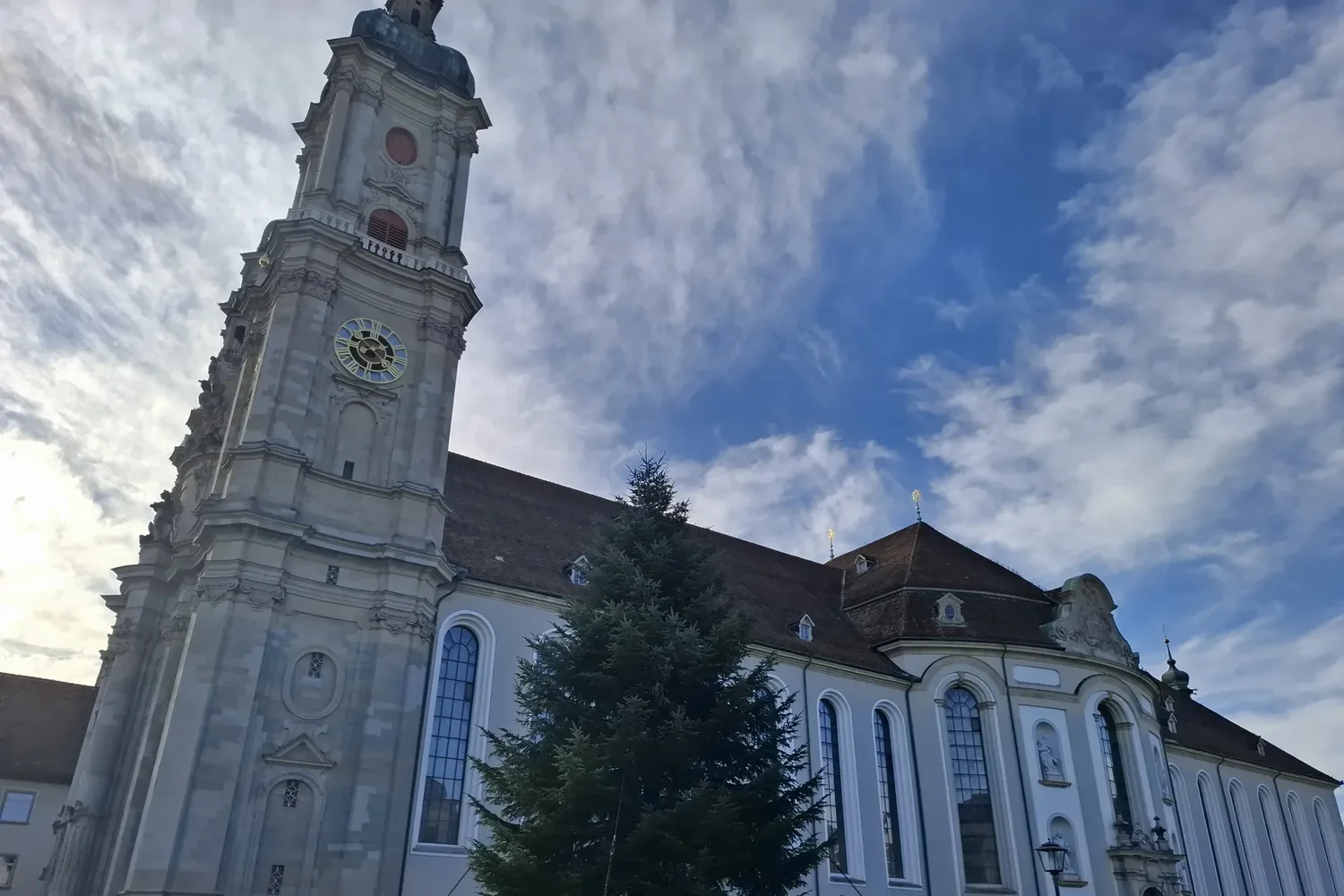 Tower of the cathedral in the Abbey District of St. Gallen against a blue sky