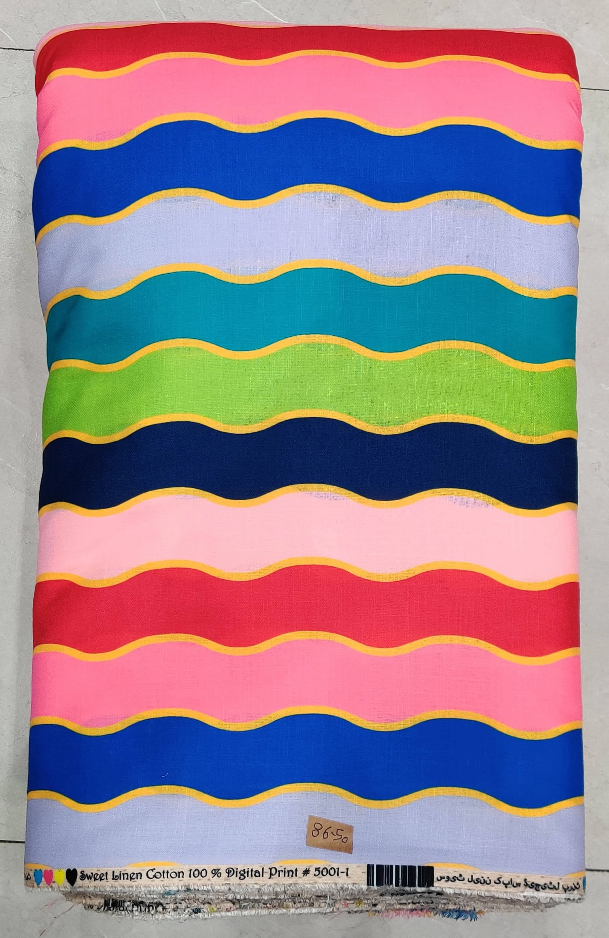 Vibrant multi-colored striped fabric featuring horizontal bands of bright pink, orange, green, and blue with fine wavy line patterns.