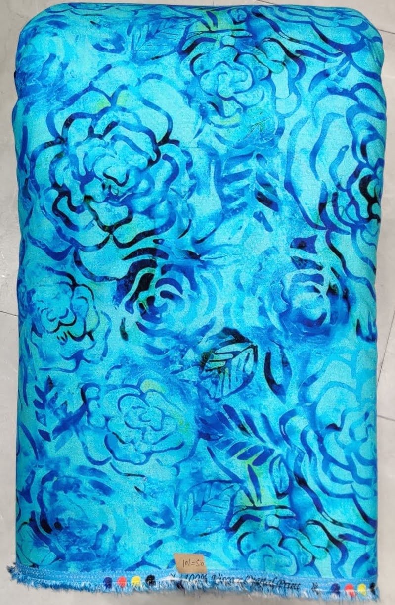Vibrant turquoise-blue and deep azure-indigo textile featuring a botanical watercolor layout with lush blooming florals, soft painterly washes, and delicate leafy trails.