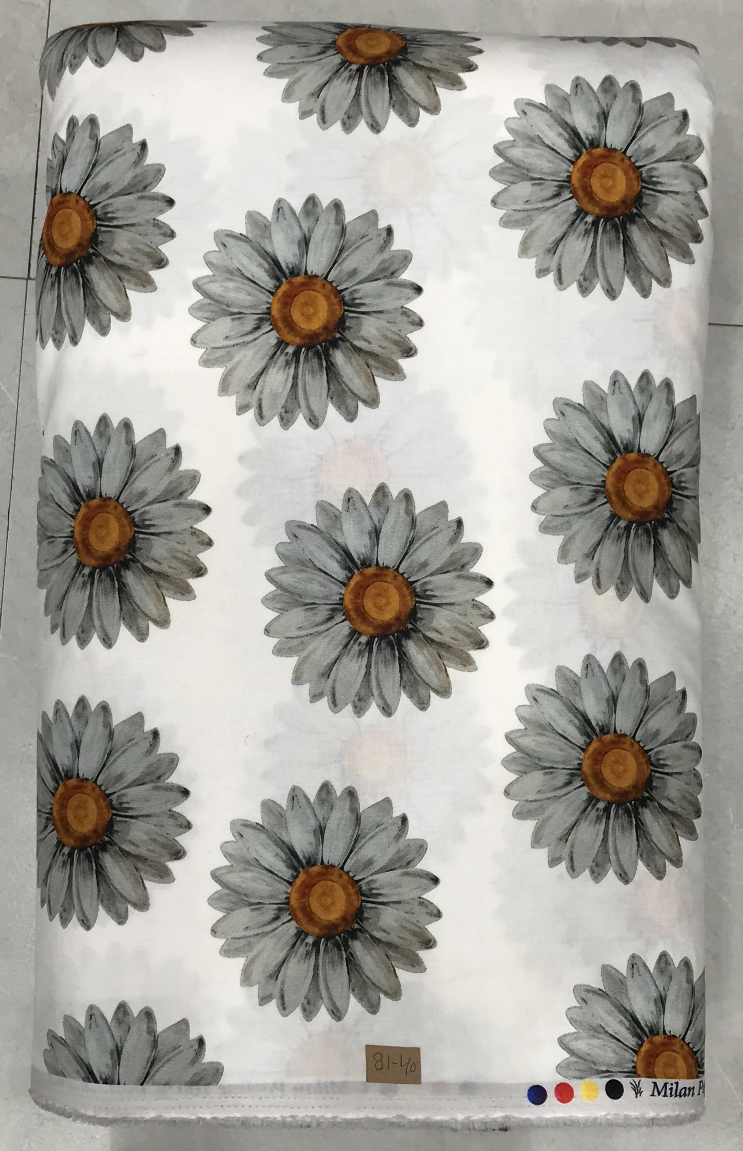 Crisp white background featuring a repeating pattern of large, stylized daisy-like flowers with textured grey petals and prominent golden-yellow centers.