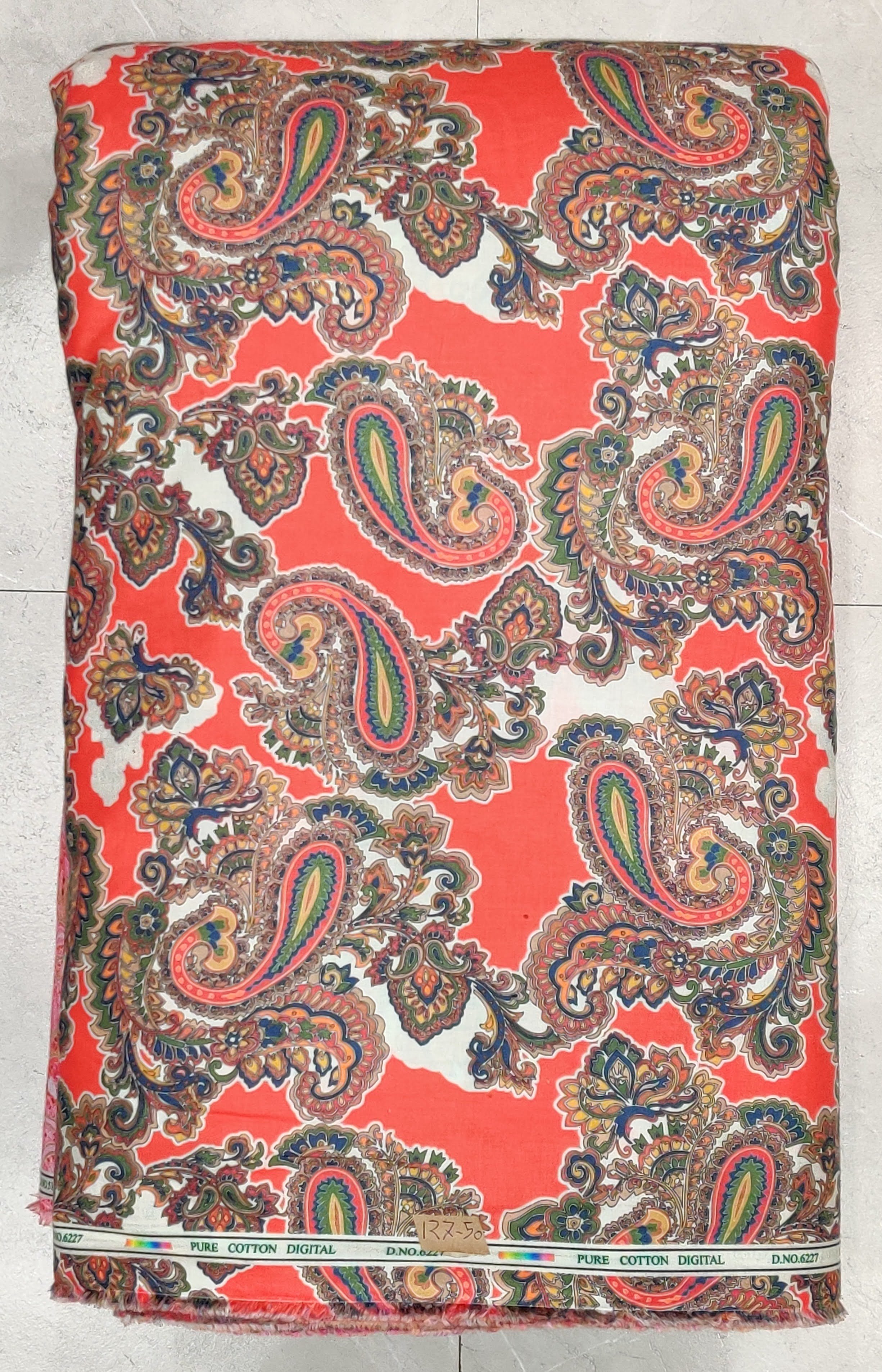 Bright red base covered with large, classic paisley patterns featuring intricate black and white detailing.
