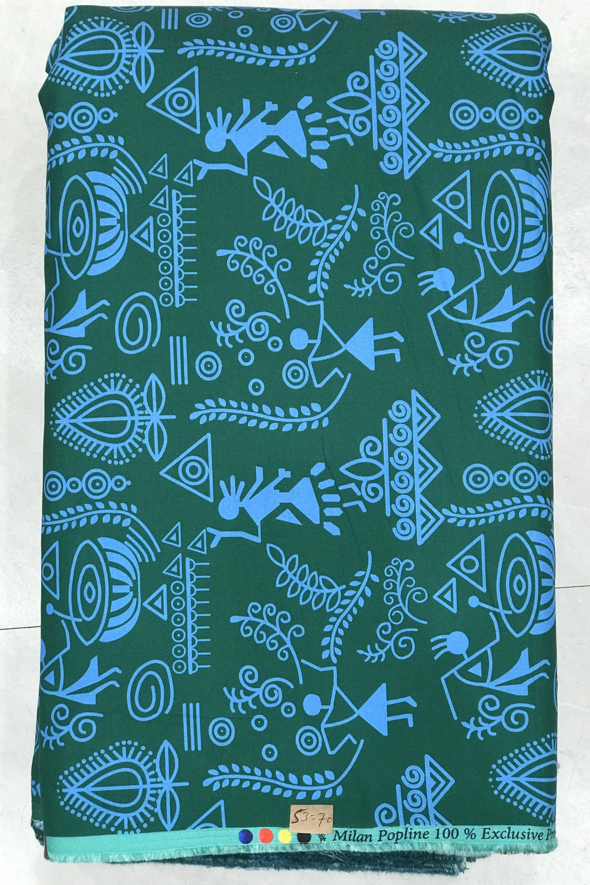 Rich royal blue background featuring a dense, vibrant abstract botanical print with swirling organic leaf motifs and delicate multi-colored floral details.