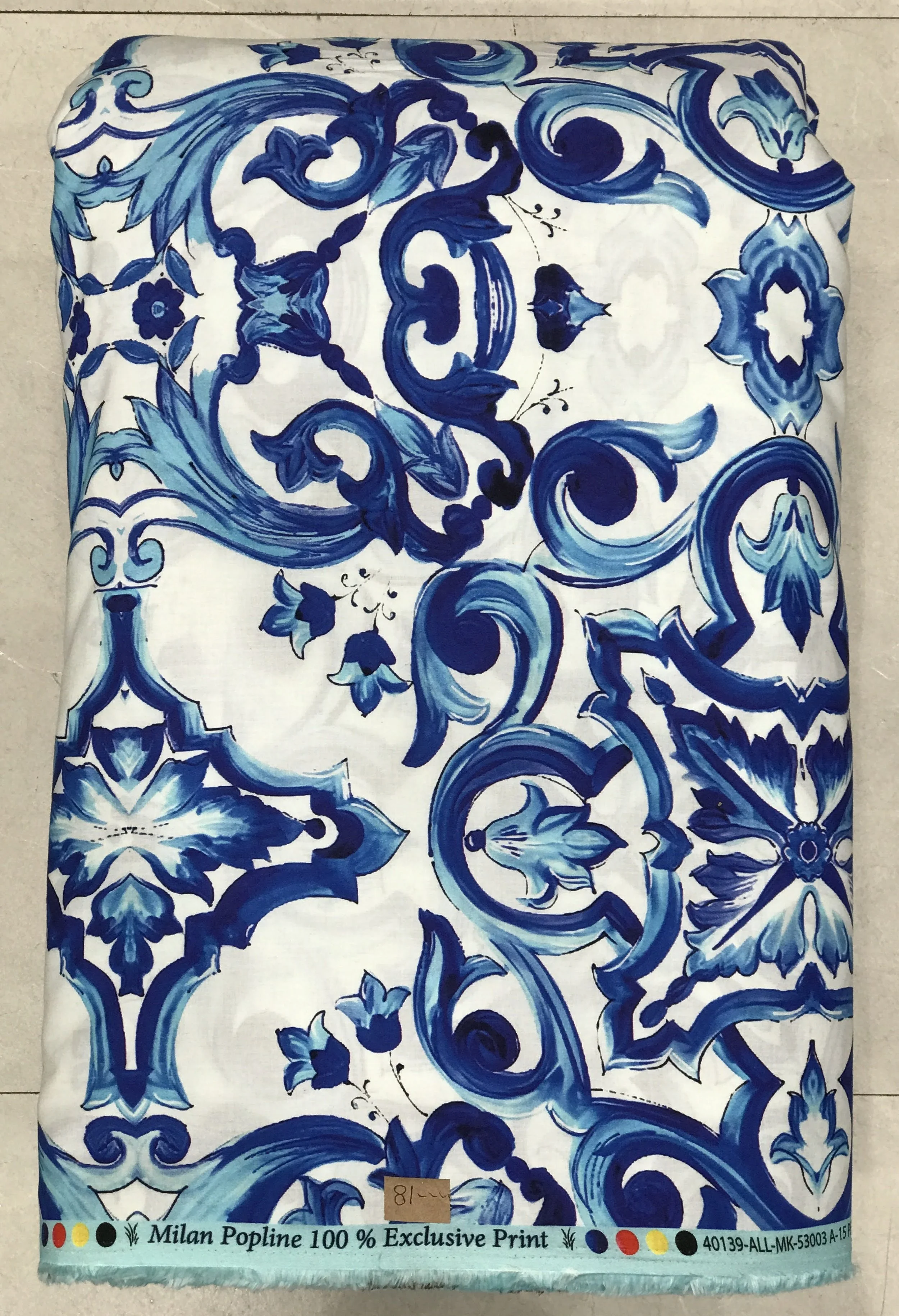 Crisp white background featuring a bold, dramatic Spanish majolica-inspired print with intricate cobalt blue scrolling baroque tiles and Mediterranean motifs.