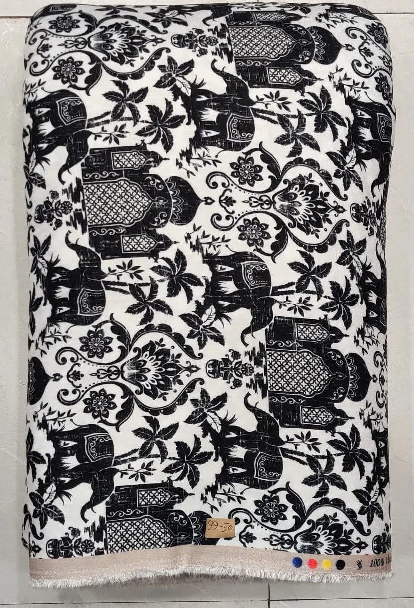 Deep midnight-black and crisp ivory textile showcasing a bold geometric motif featuring structured tribal symbols, rhythmic zigzag bands, and sharp linear alignments.