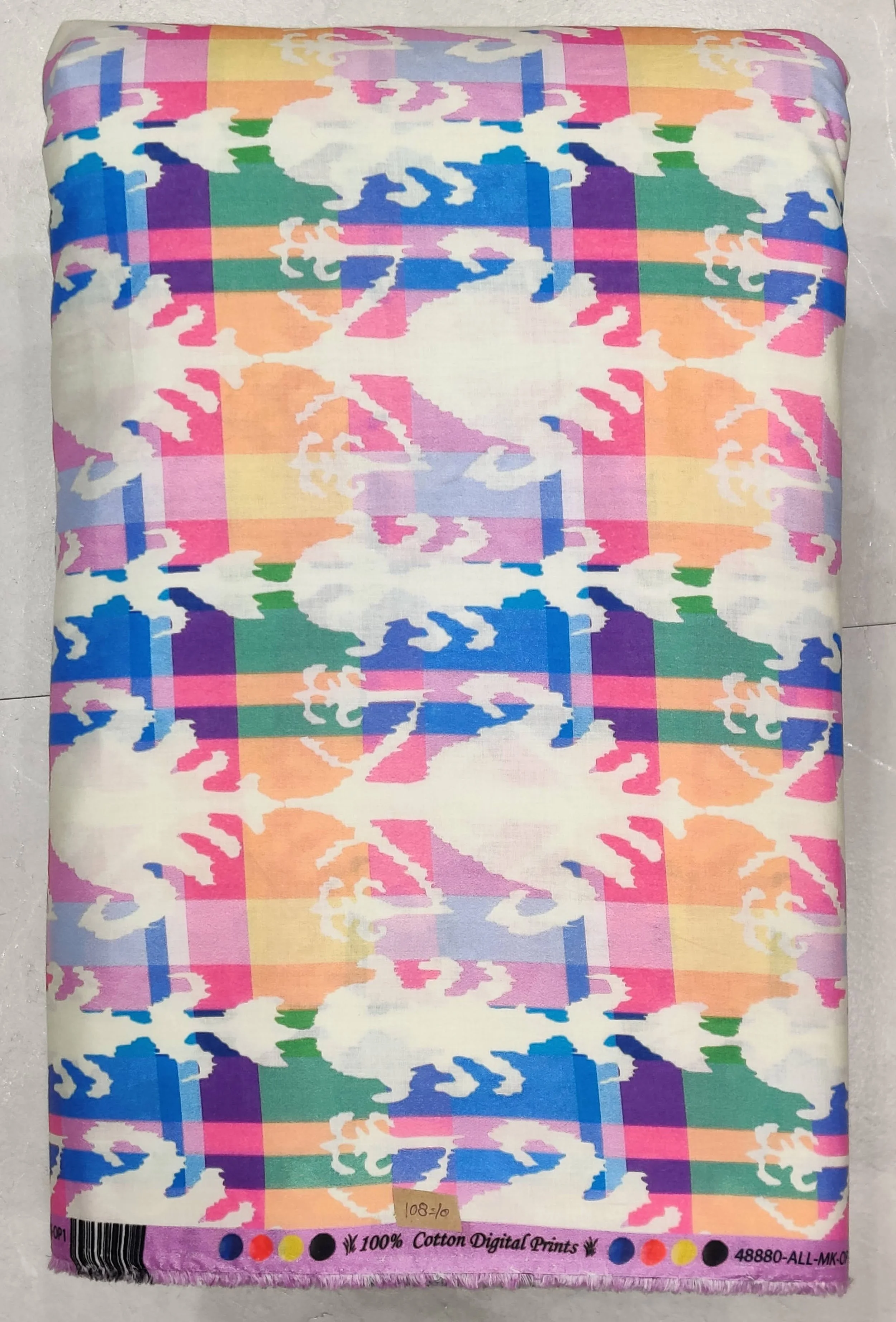 Vibrant multi-color plaid background featuring intersecting stripes of yellow, pink, blue, and green, overlaid with repeating white crab silhouettes.