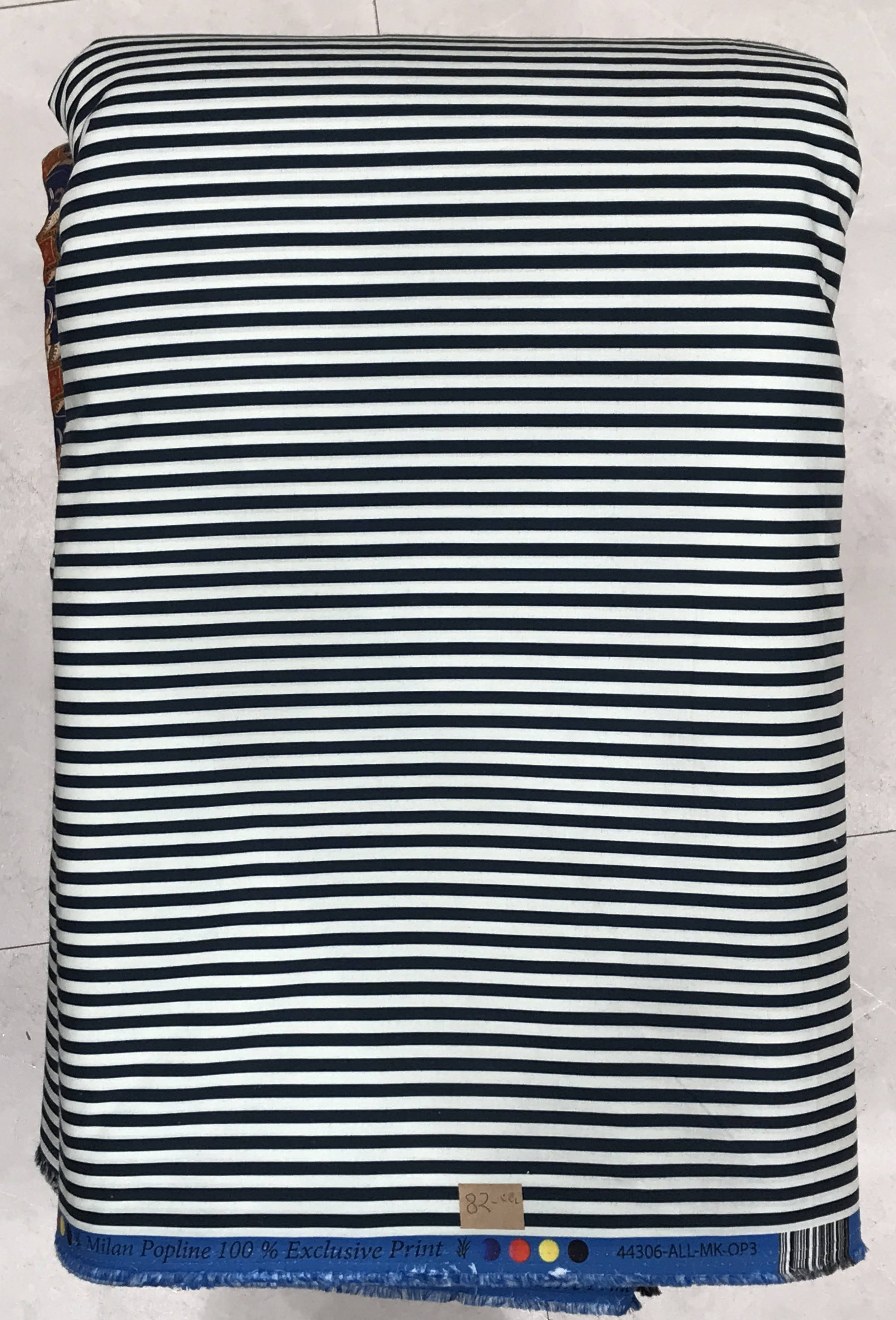 A neat stacked roll of soft fabric featuring a clean, fine horizontal stripe pattern with alternating narrow bands of black, white, and subtle blue-grey lines against a textured neutral background.