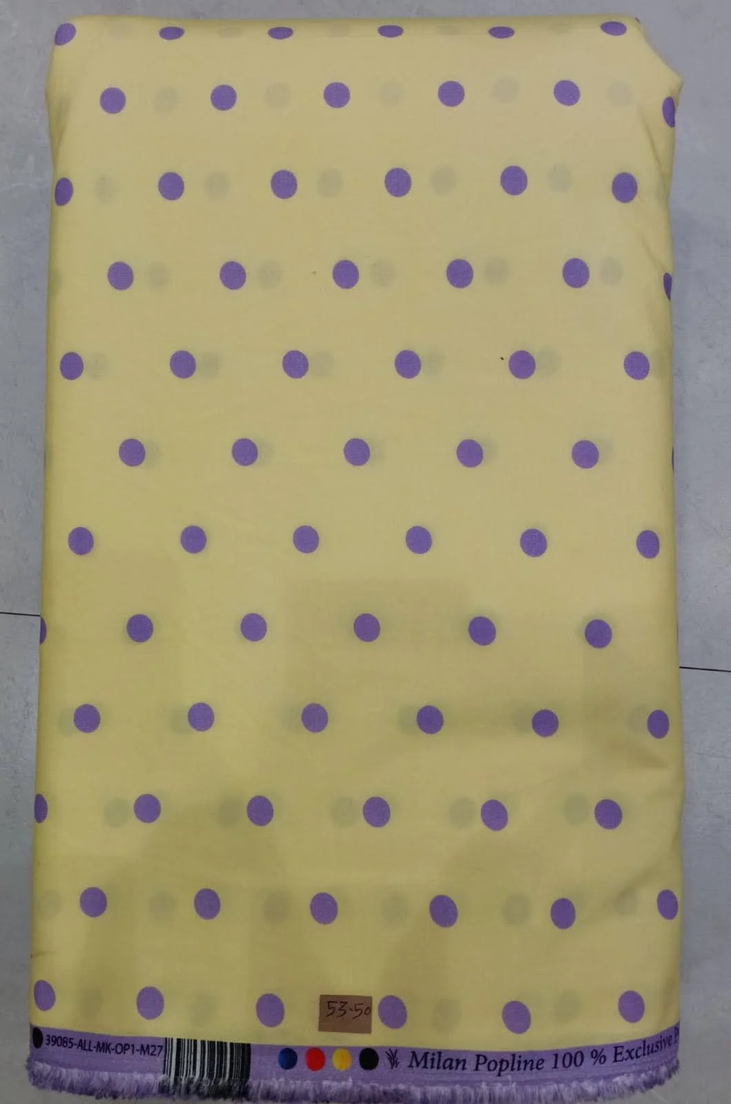 Soft mustard-yellow background featuring a traditional, ornate Indian block-print design with repeating rows of delicate floral motifs, intricate vines, and small blossom accents.