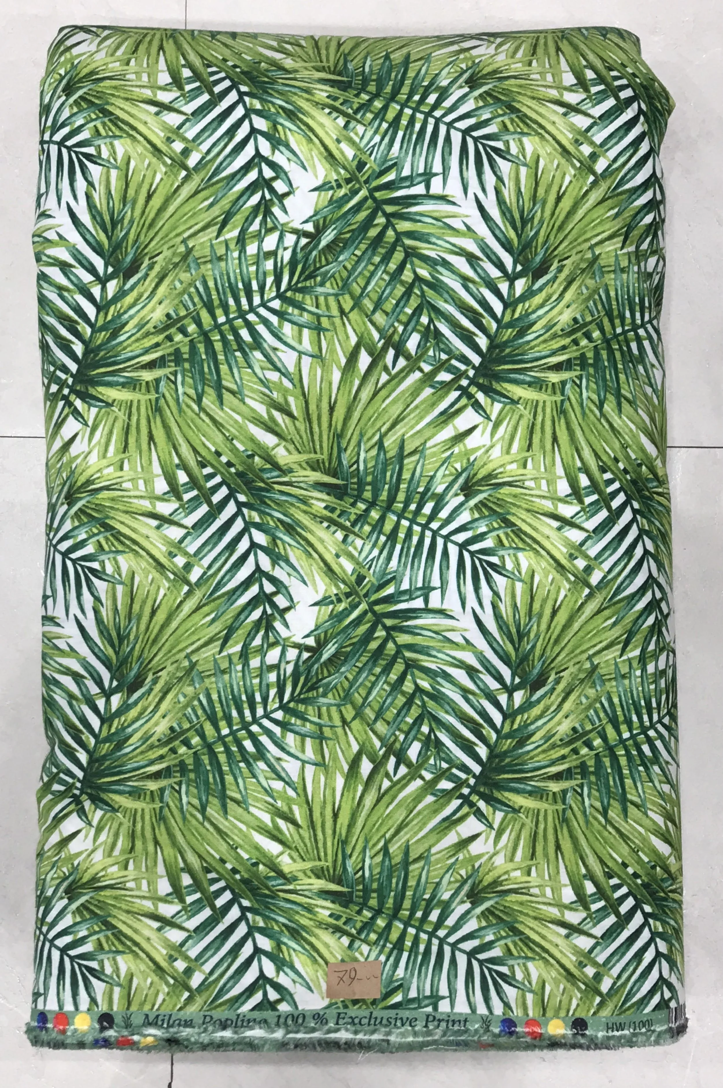Rich green background featuring a lush, dense tropical jungle print with vibrant green palm fronds, ferns, and exotic botanical leaves.