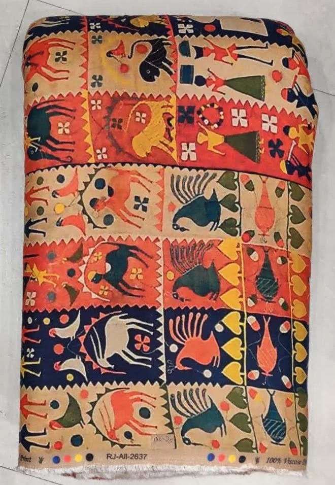 Vivid rust-orange and midnight-black textile showcasing a folk-art animal print featuring stylized foliate creatures, traditional tribal motifs, and intricate geometric framing.