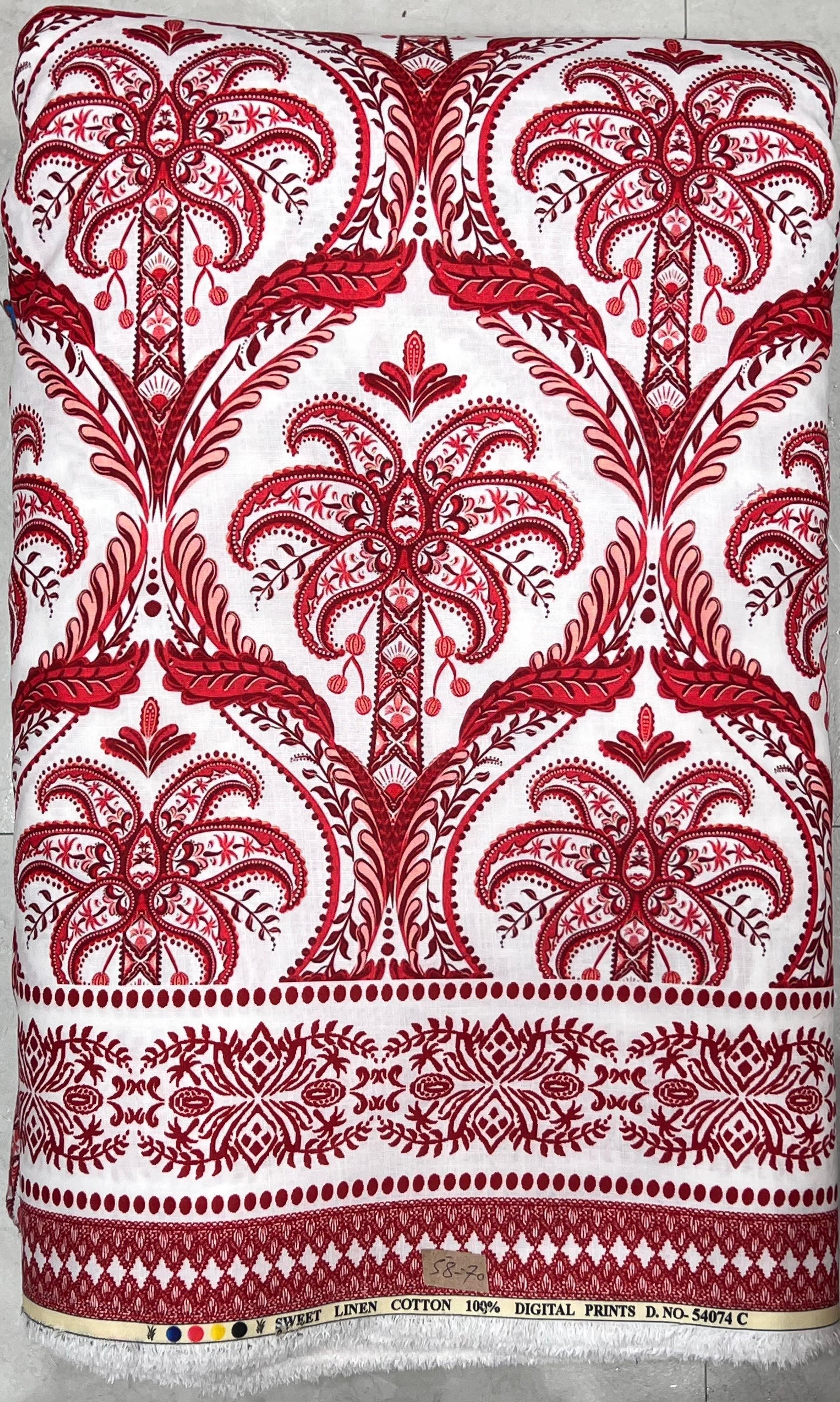 Crisp white and ruby-red fabric featuring an intricate baroque-style damask medallion pattern along the center panel, finished with a decorative geometric border hem for statement ethnic wear.