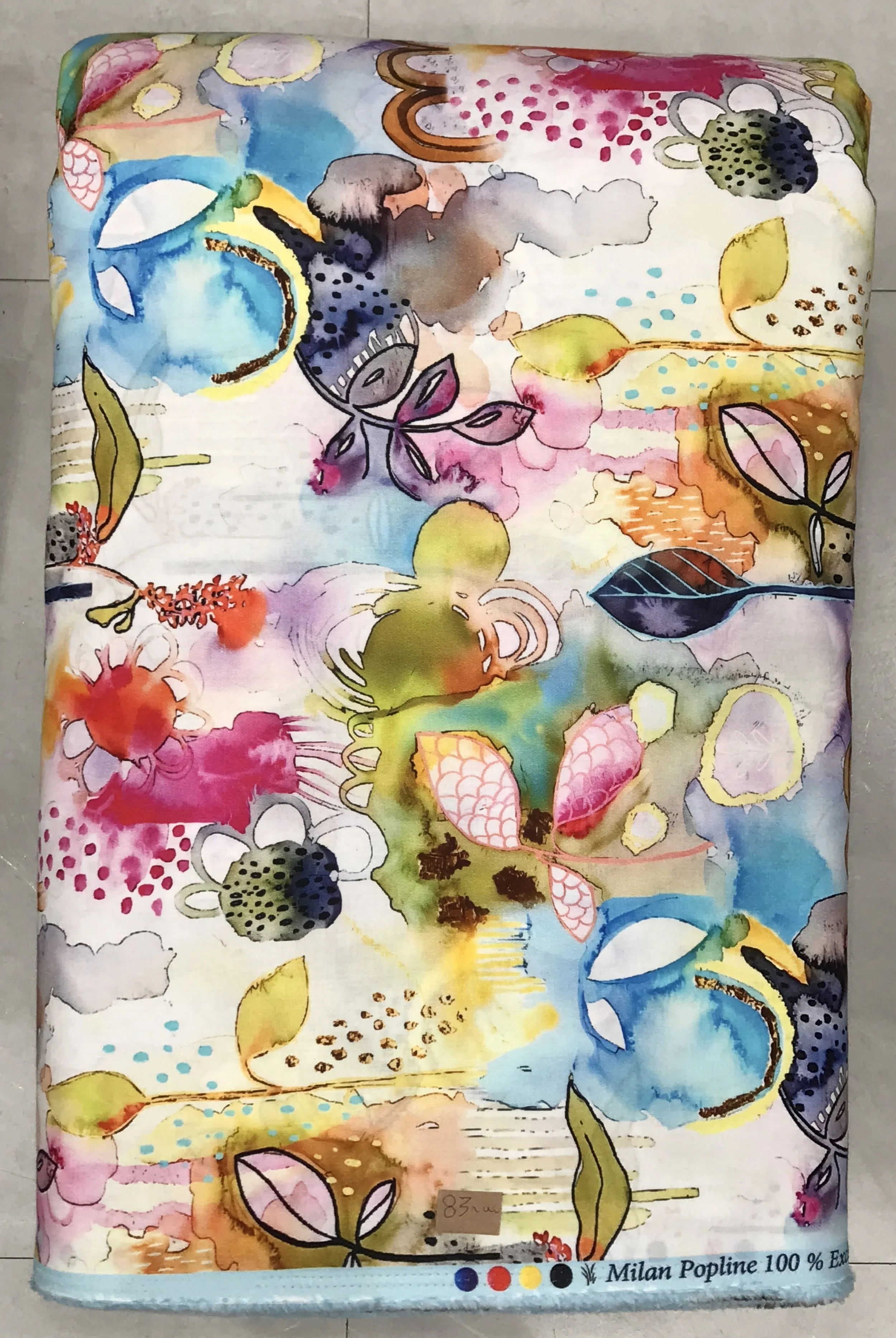 Textured white and cream background featuring an abstract, watercolor-style painterly splash print with expressive strokes of bright yellow, turquoise, magenta, and olive green.